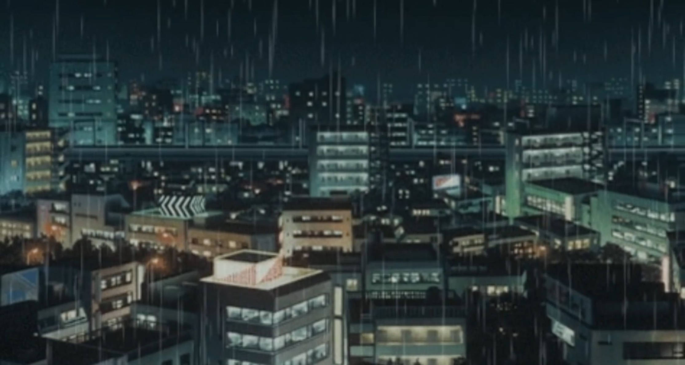 東京 桌布 壁紙 — 雨水沿著霓虹燈照亮的城市夜景傾瀉而下，發光的窗戶和濕漉漉的街道反射著城市燈光。