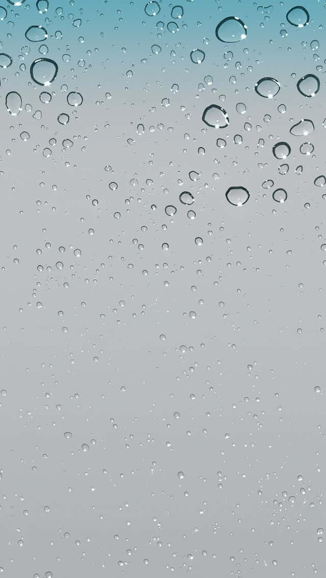 iPhone 5s 桌布 壁紙 — 雨滴依附在窗玻璃上，背景是柔和漸變的天空，從藍綠色過渡到灰色。