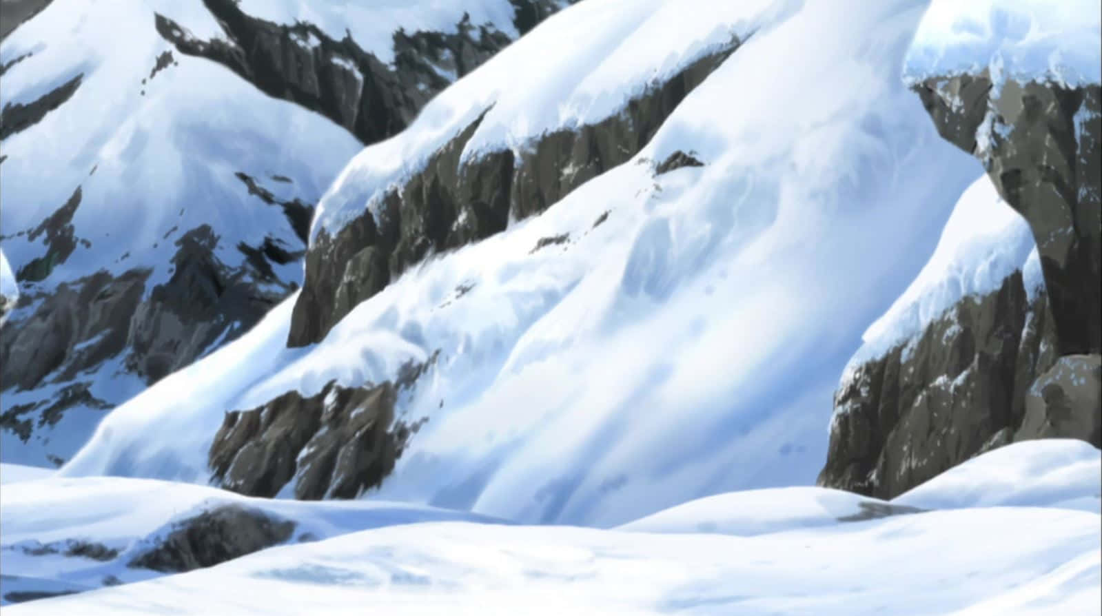 雪山荒野的壯麗美景 壁紙 — 白雪覆蓋著崎嶇的山峰和岩石斜坡，在清澈的冬日天空下。