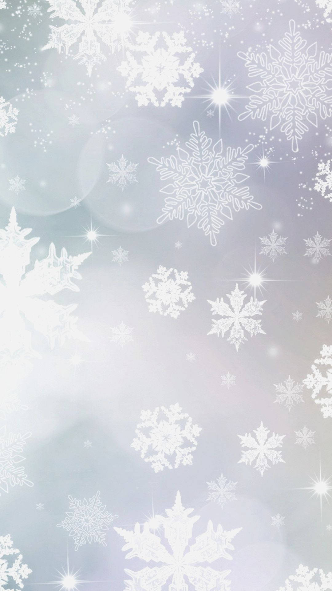 雪花和星芒在柔和的粉彩冬日天空中飄浮，帶有散景燈光。