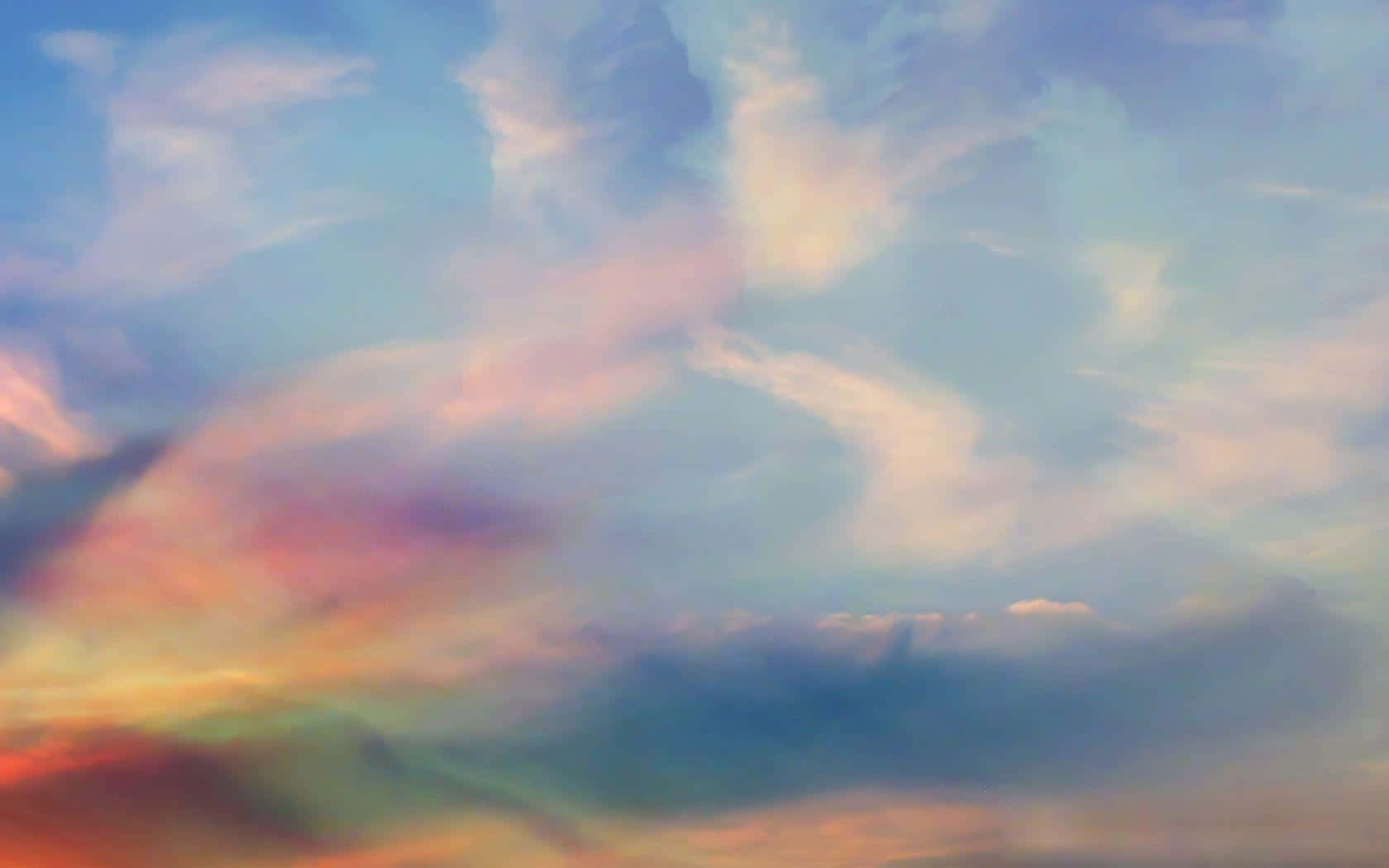 雲上漫遊，感受美學寧靜 壁紙 — 夢幻般的天空，塗上柔和的粉彩雲朵，在黃昏時散發出粉紅、橙色和藍色的光芒。