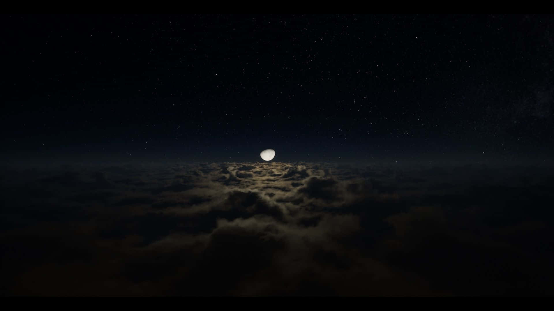 月亮在星夜下從雲層上升起