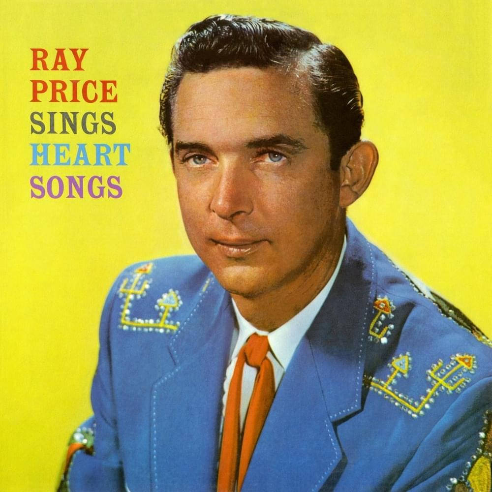 Ray Price 身穿藍色刺繡西裝和橙色領帶，在黃色背景上。