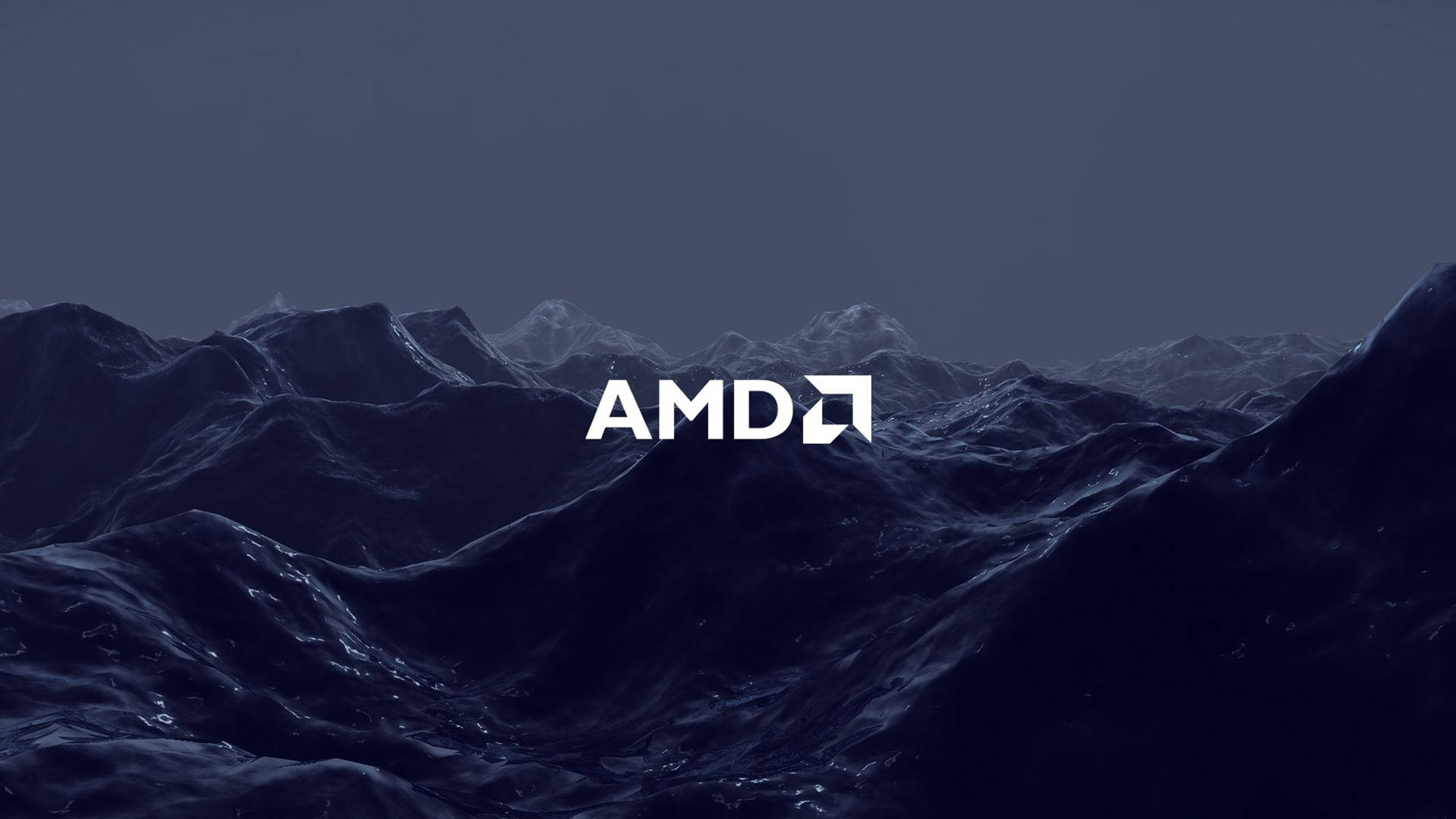 AMD 標誌顯示在夜晚的黑暗山景之上。