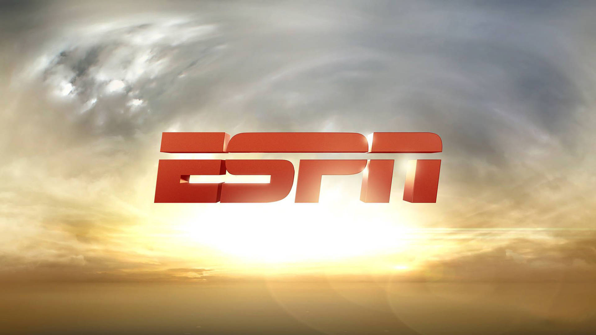ESPN 標誌漂浮在充滿活力的日落天空上，帶有金色雲彩。