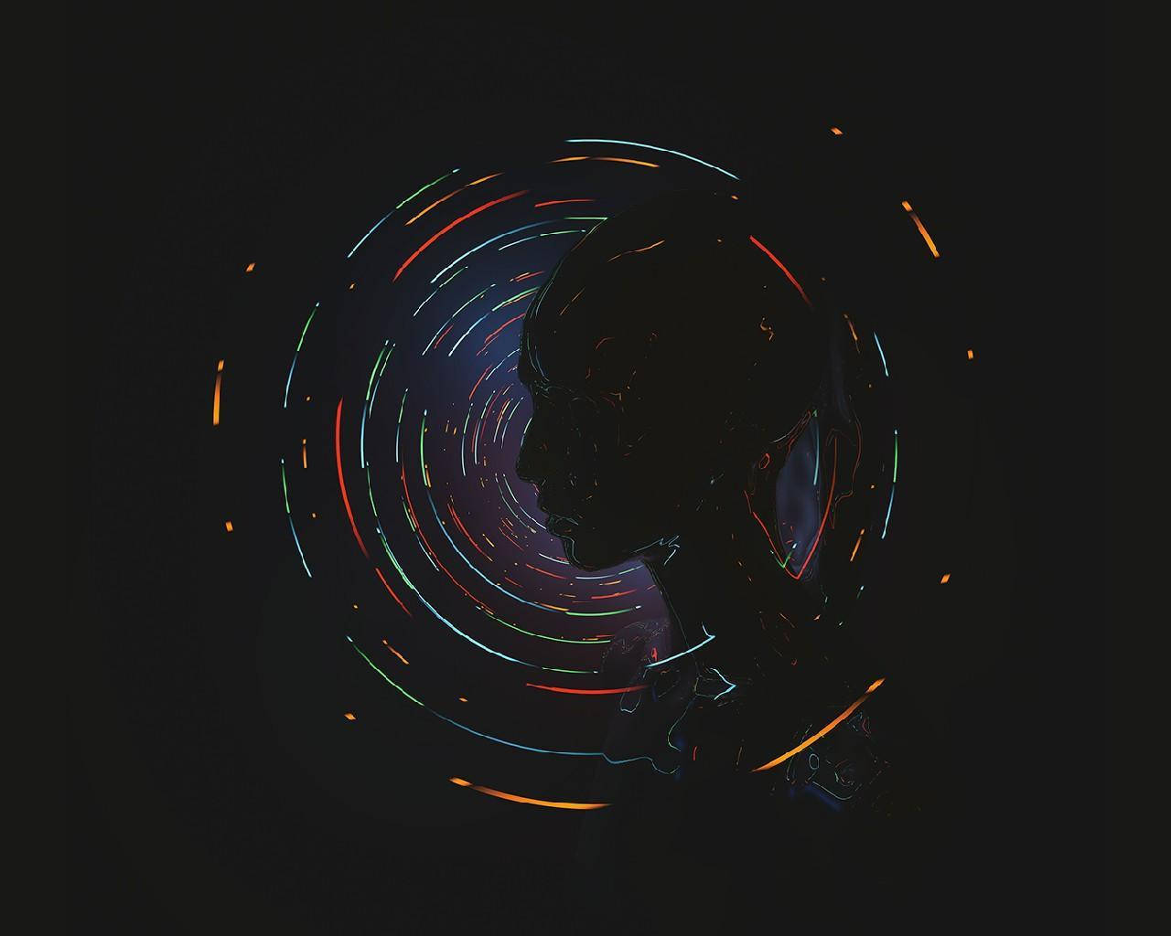 霓虹夜景城市 壁紙 — 一個黑色背景上，被旋轉霓虹光軌包圍的人類頭部側面黑色剪影。