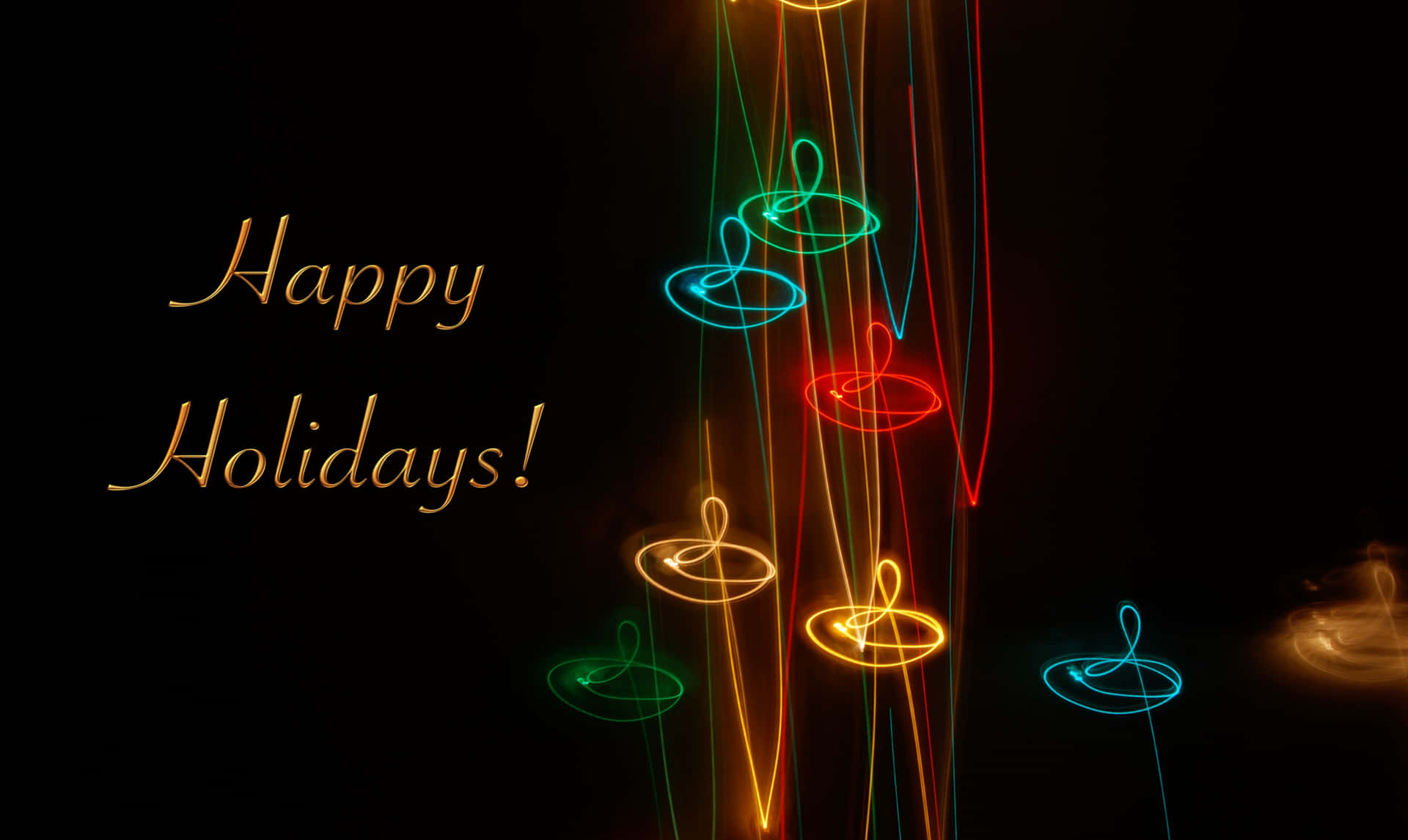 黑色背景上帶有彩色發光光軌的Happy Holidays文字