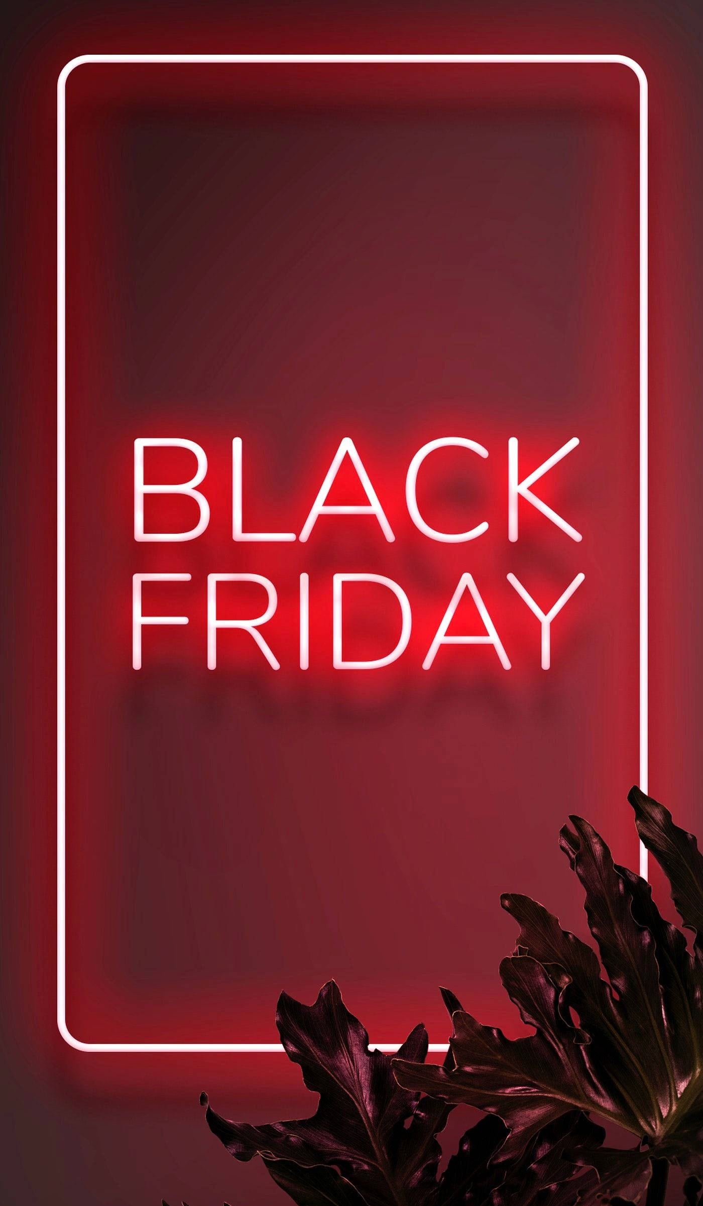 霓虹紅色黑色星期五特賣 壁紙 — 粗體白色霓虹燈文字「BLACK FRIDAY」在長方形框架內發光，背景是深紅色牆壁，底部有深色樹葉。