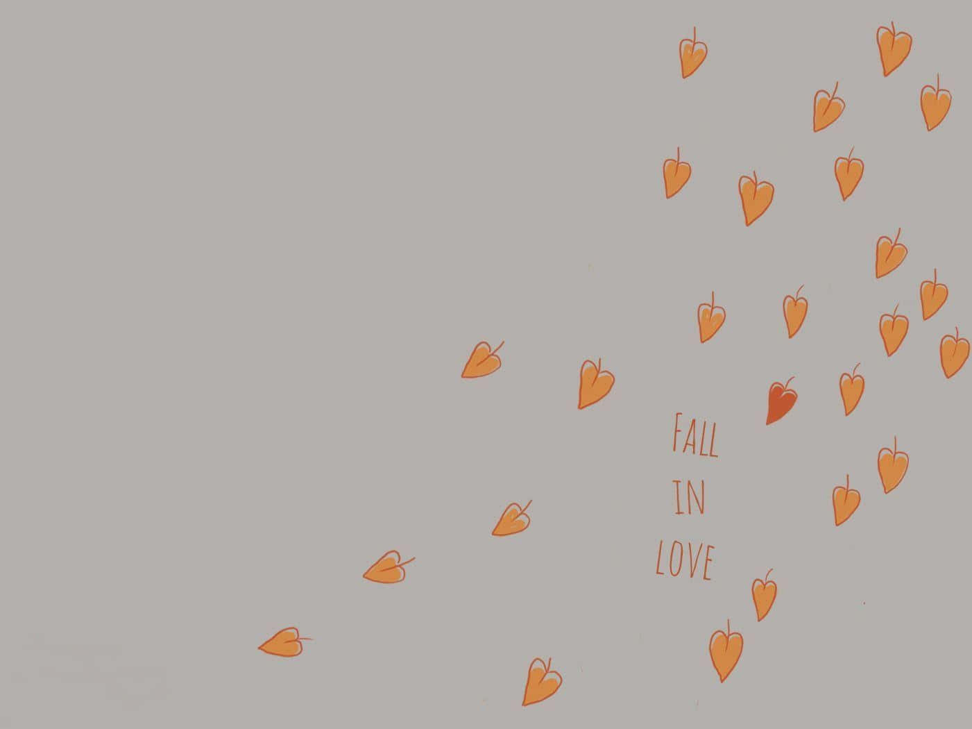 橙色心形圍繞灰色背景上的 fall in love 字樣飄浮。