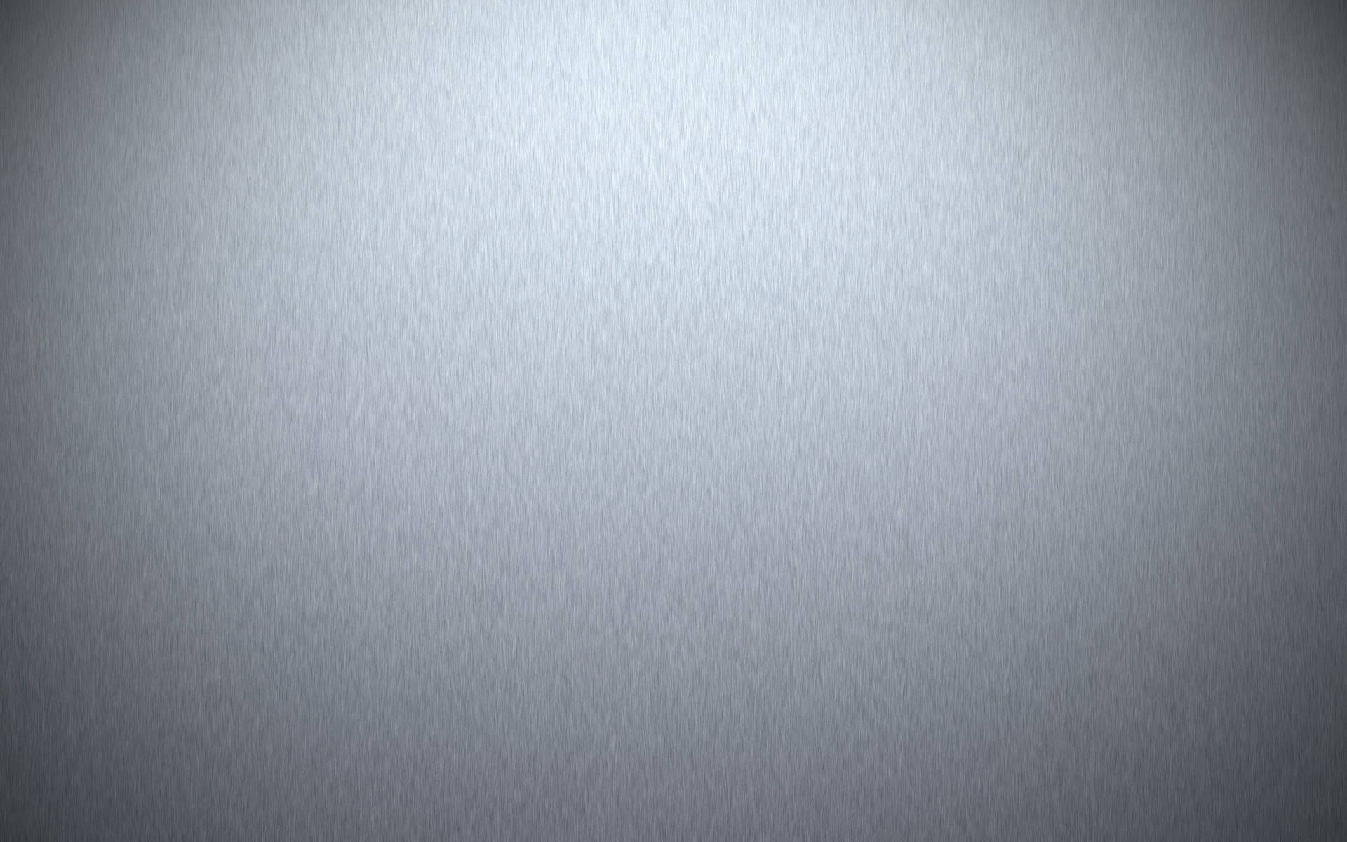 帶柔和光暈的平滑拉絲銀色漸變紋理。