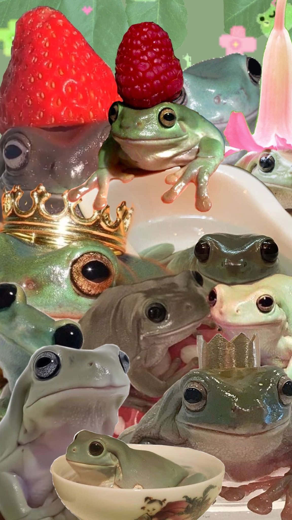 Cute Frog 桌布 壁紙 — 青蛙喺一個奇幻花園場景中，戴住皇冠同水果帽，配粉紅色花同綠色葉。