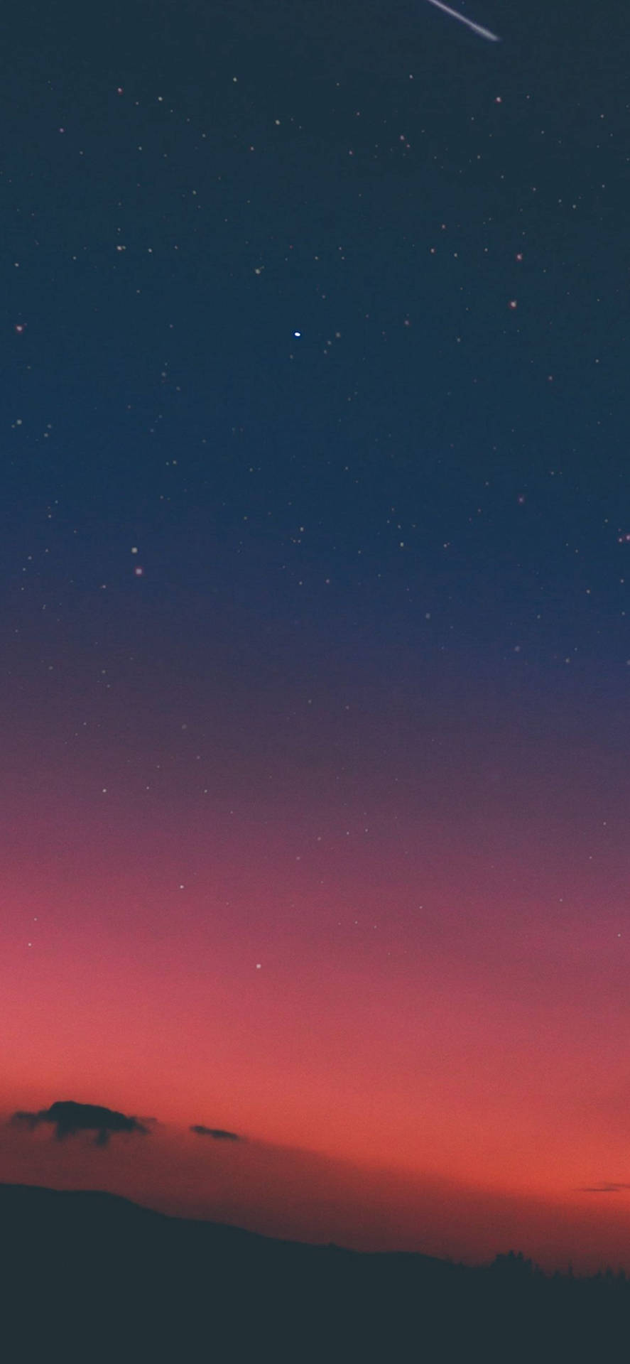星空暮色天空，山脈和流星。