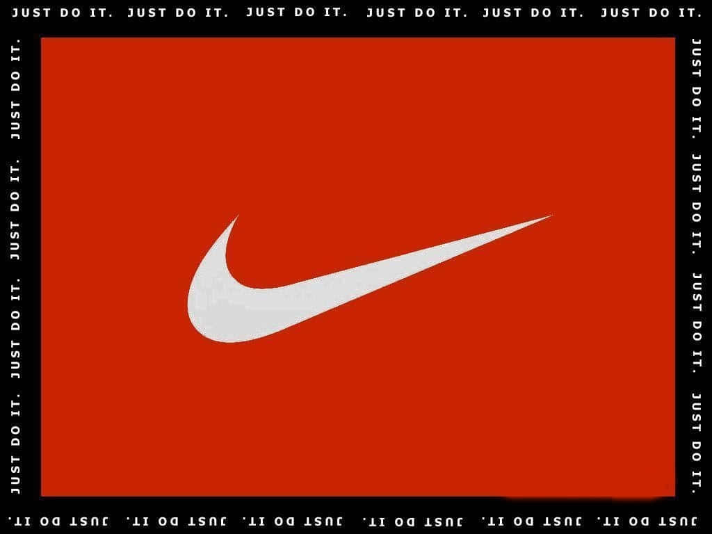 非凡紅色Nike — 点燃你的表現 壁紙 — 一個大膽的白色Nike swoosh標誌，居中於鮮豔的紅色背景上，帶有重複的黑色「JUST DO IT」文字邊框。