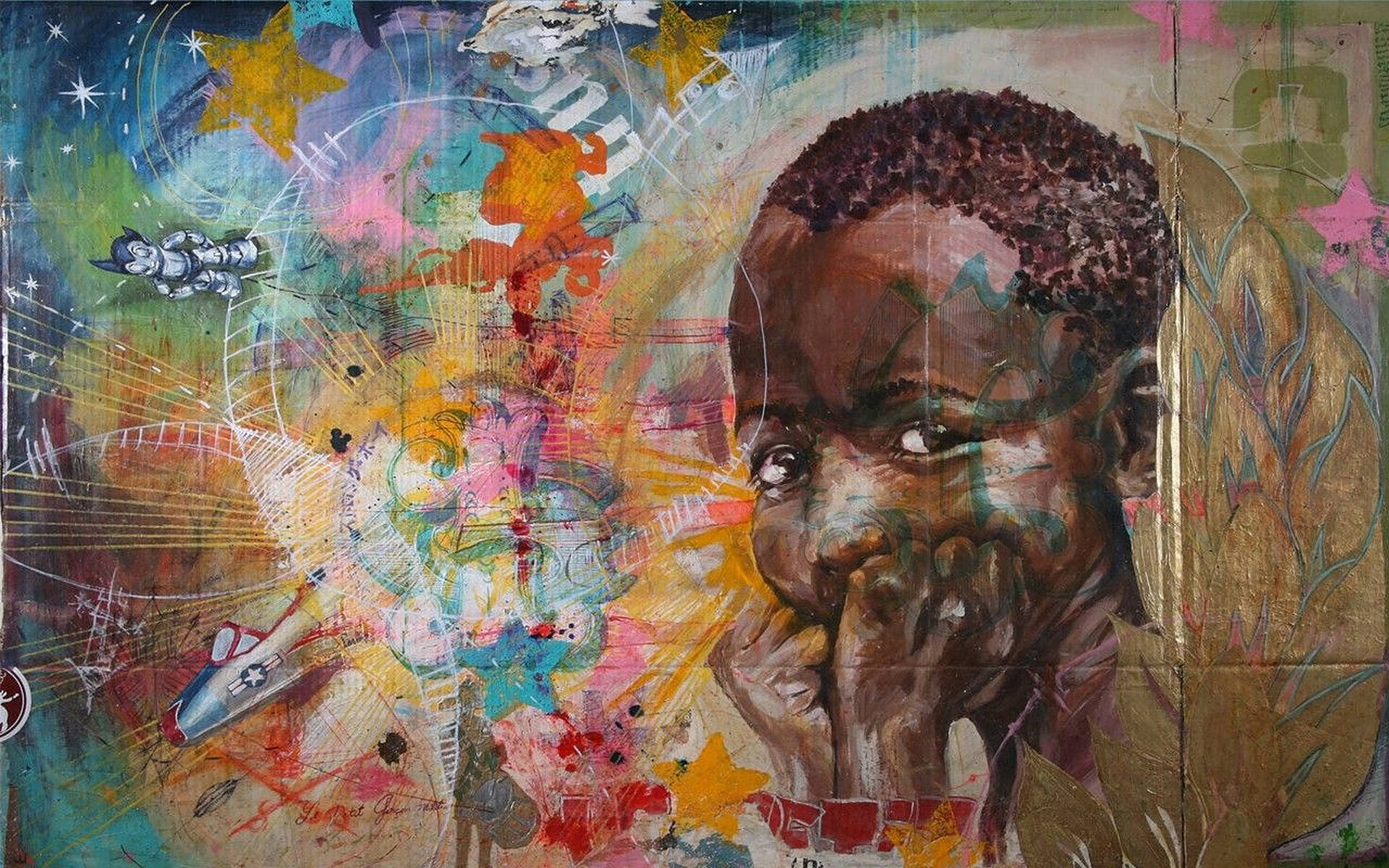 非洲塗鴉藝術 壁紙 — 一幅充滿活力的抽象畫，描繪一位年輕黑人男孩手托下巴，周圍環繞著星星、火箭和色彩繽紛的混亂筆觸。