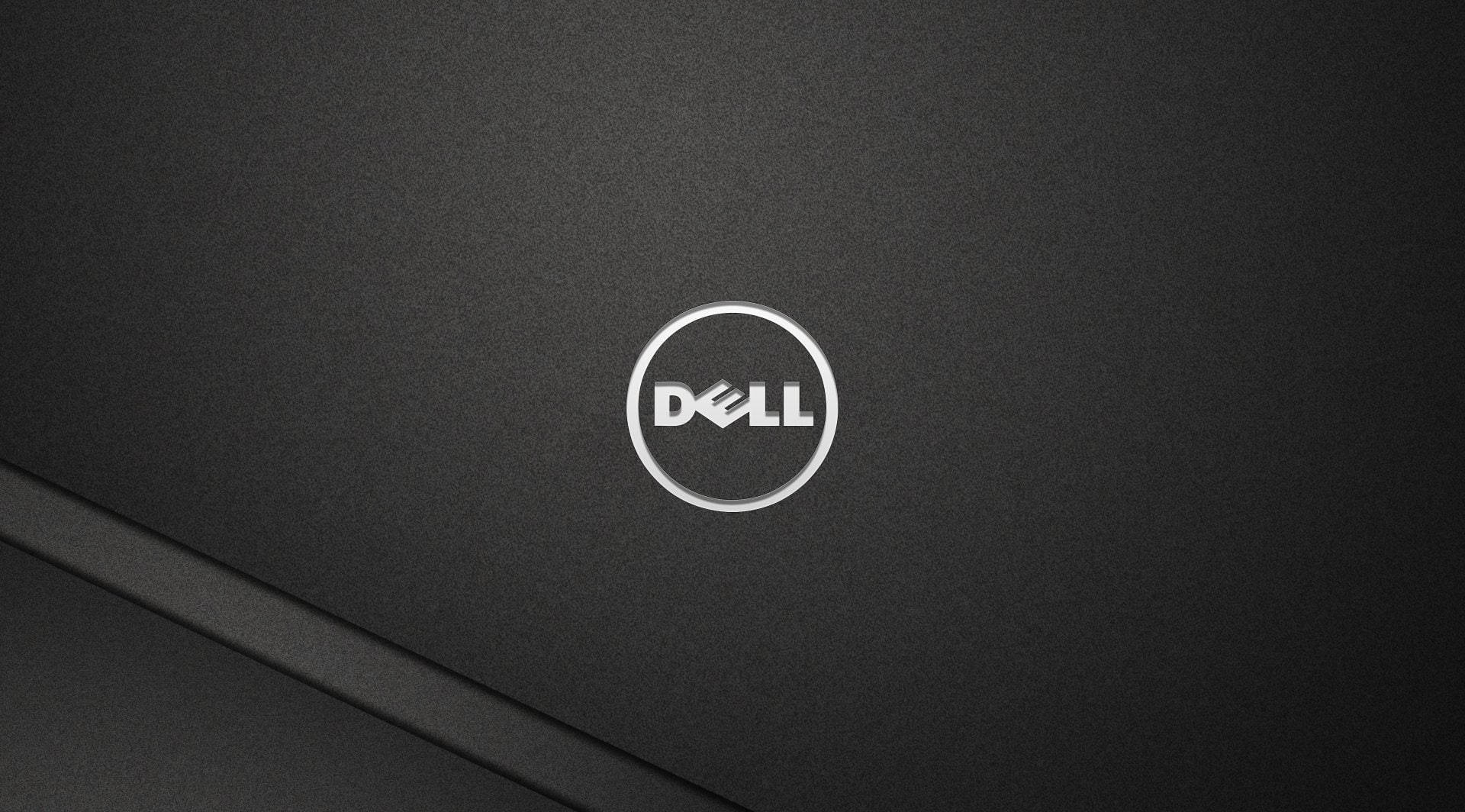 Dell手提電腦蓋的近距離特寫，銀色標誌位於黑色紋理表面上。