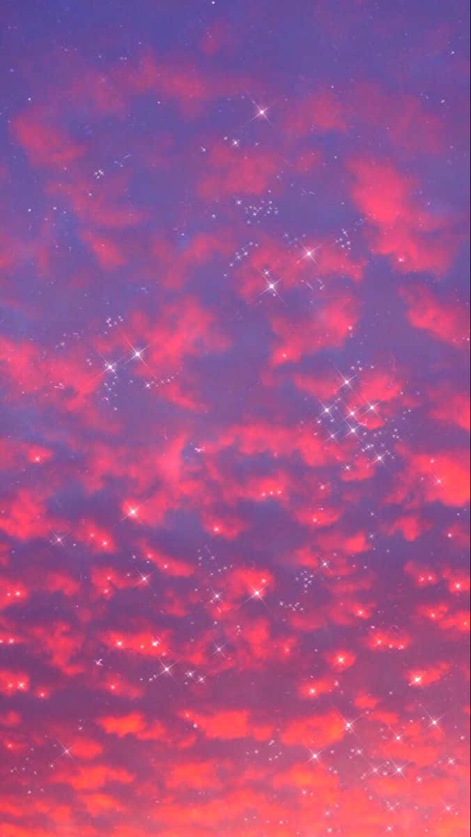 星光閃爍的暮色天空，帶有發光的紅色和紫色雲彩以及閃爍的光芒。