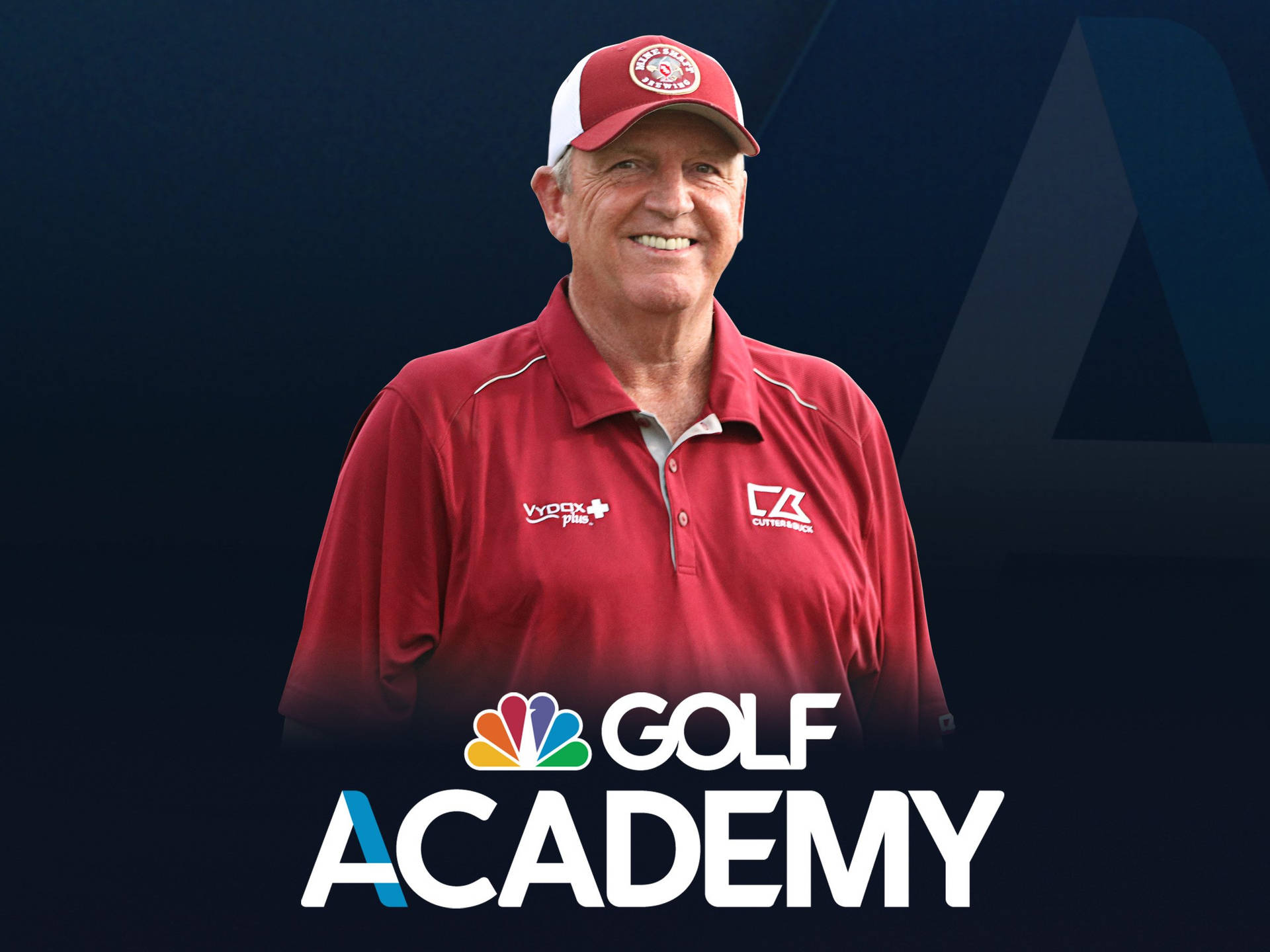 一位微笑的男性，身穿高爾夫球服裝，帶有 Golf Academy 標誌。