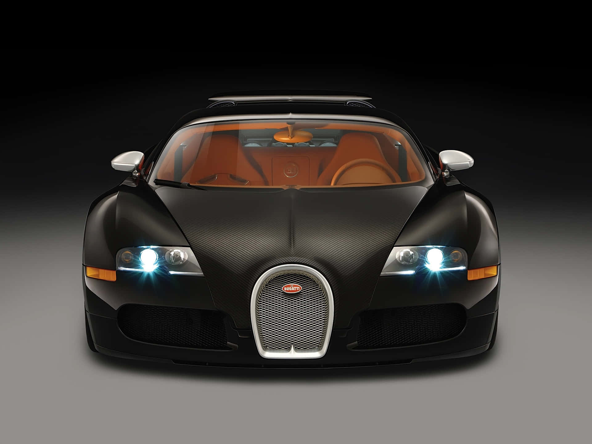 黑色Bugatti Veyron，橙色內飾和發光頭燈，在攝影棚燈光下。