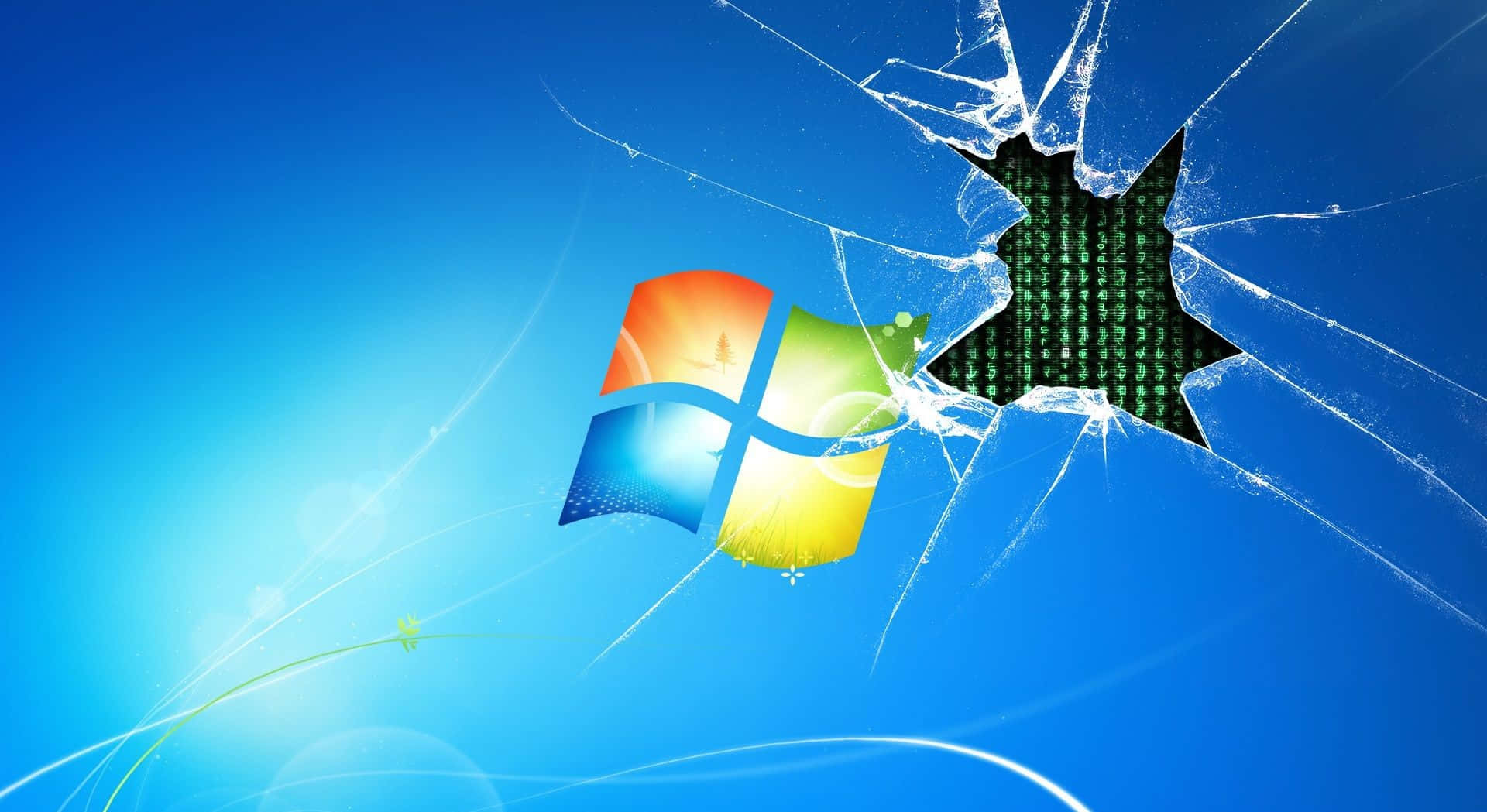 碎裂玻璃揭示了藍色背景上Windows標誌背後的綠色矩陣代碼。
