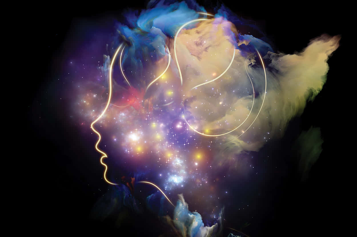體感女性輪廓藝術 壁紙 — 發光的宇宙星雲形成人類頭部和肩膀的輪廓，背景是充滿星星的黑暗虛空。