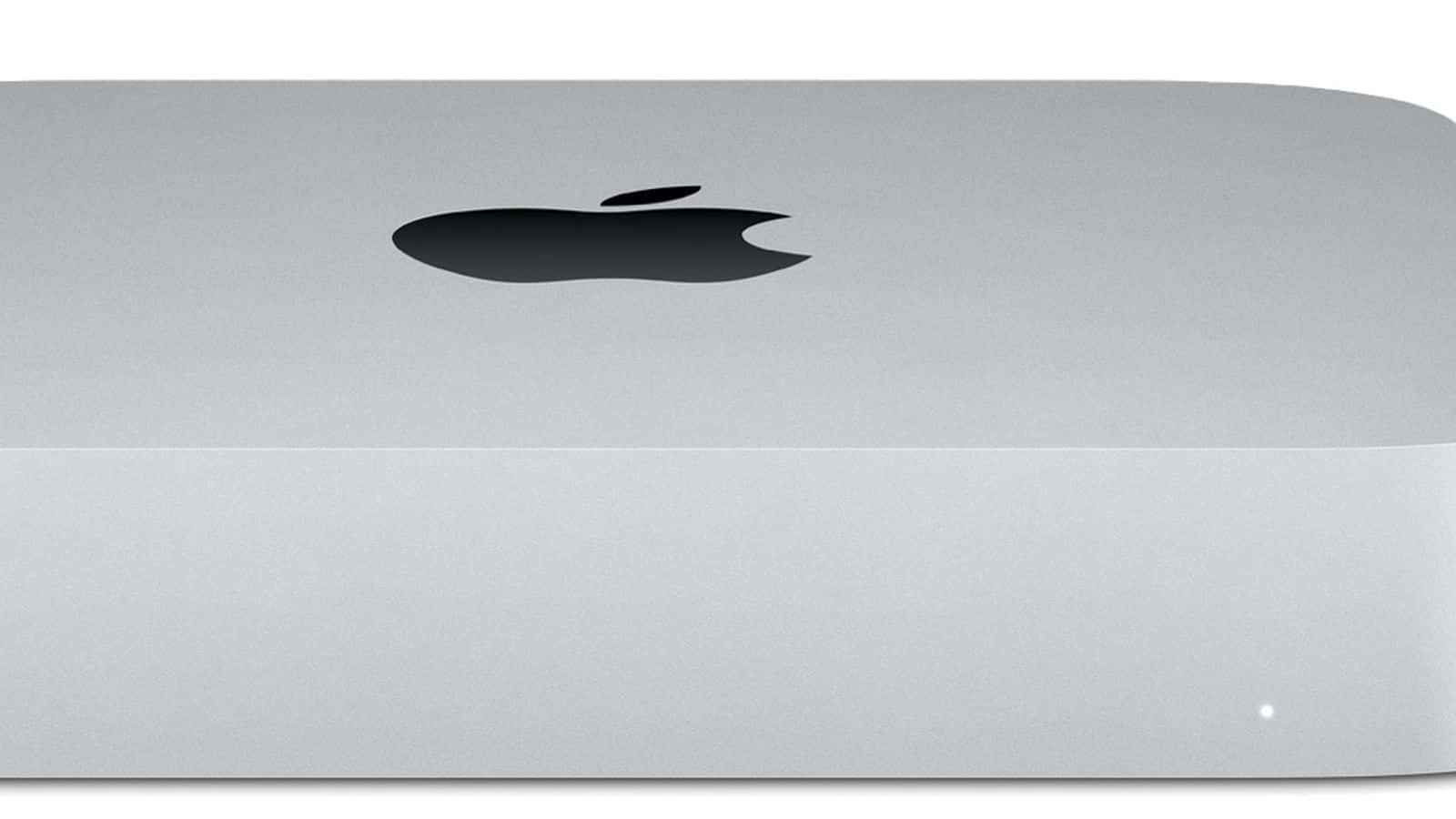 銀色 Apple Mac mini 電腦，帶黑色標誌和狀態指示燈。