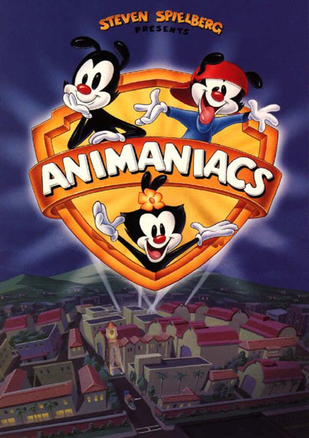 體驗Yakko、Wakko與Dot的瘋狂冒險——《Animaniacs》！ 壁紙 — 三個卡通角色在盾牌標誌中懸浮在風格化城鎮上空，背景是紫色天空。