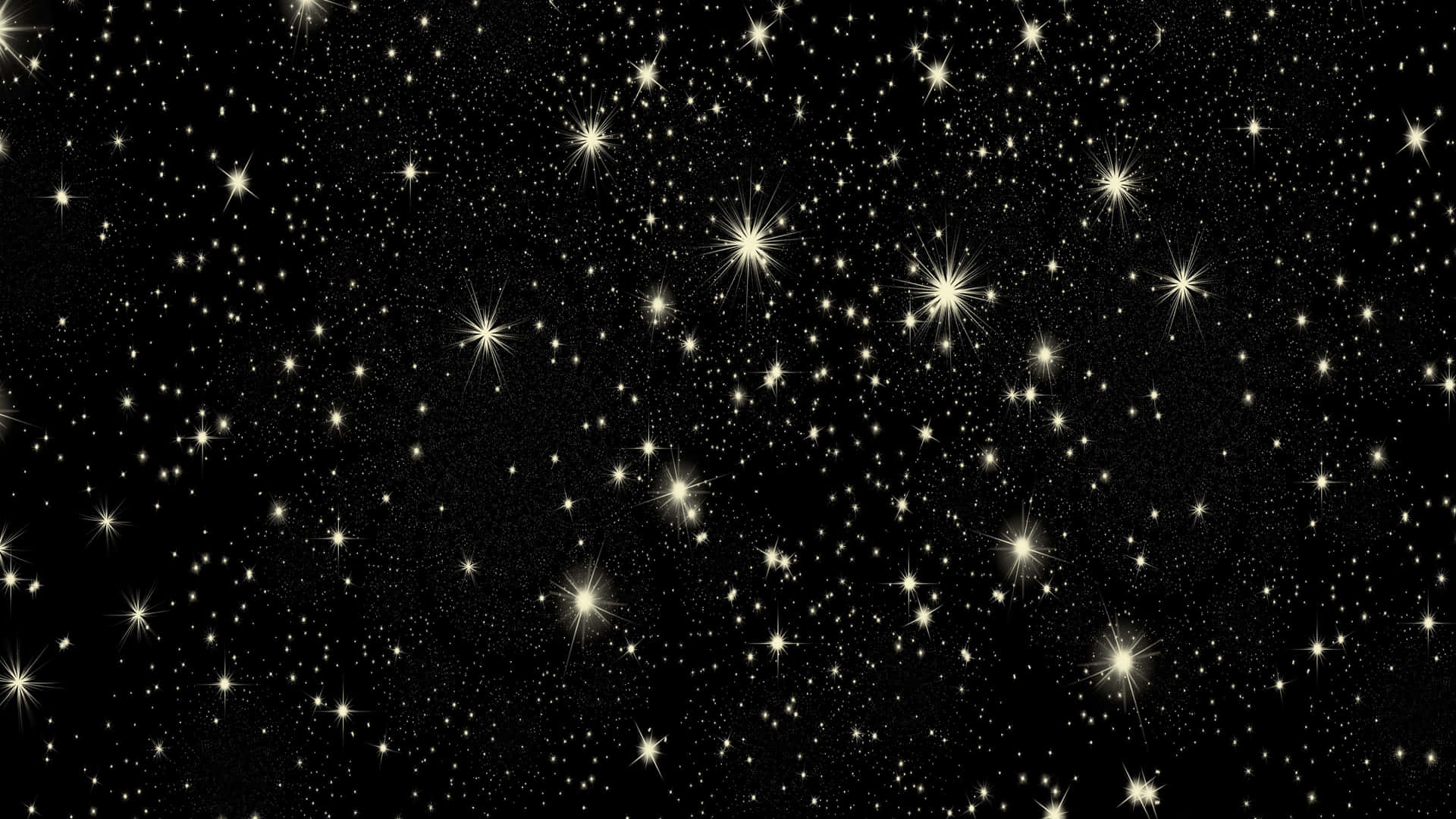 黑色背景上充滿發光金色星星的星空夜晚。