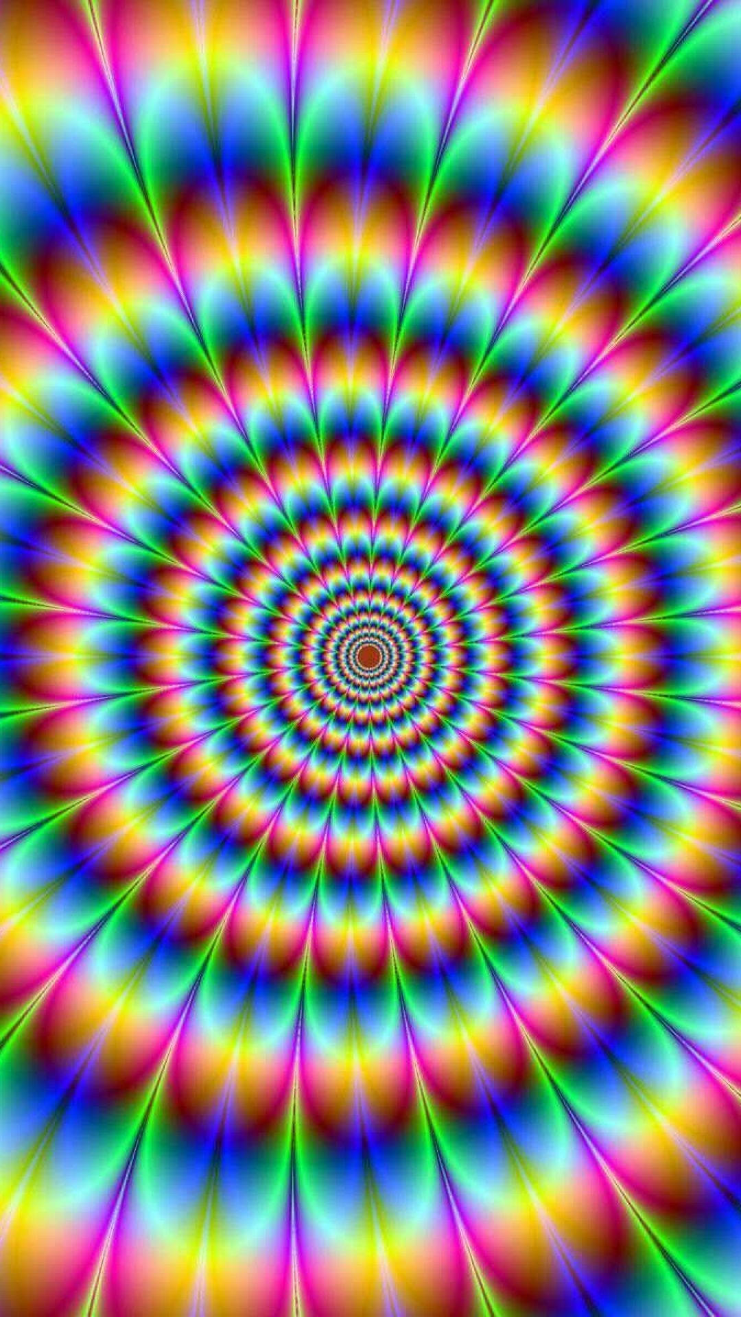 體驗嬉皮士美學的悠閒氛圍 壁紙 — 充滿活力的迷幻螺旋以催眠般的彩虹色向外輻射，創造出迷人的視錯覺。