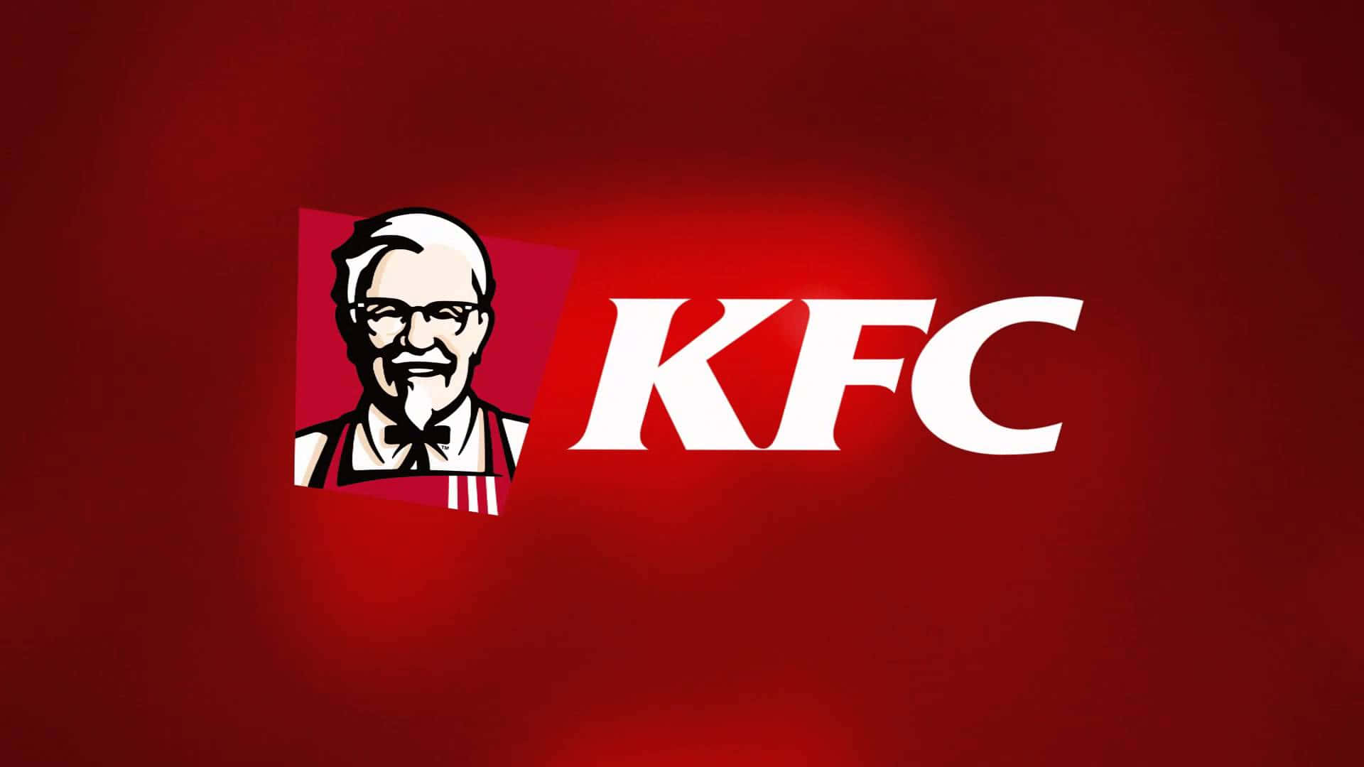 體驗肯德基令人吮指回味的美味 壁紙 — 大膽的白色KFC標誌和山德士上校肖像在豐富的紅色漸變背景上發光。