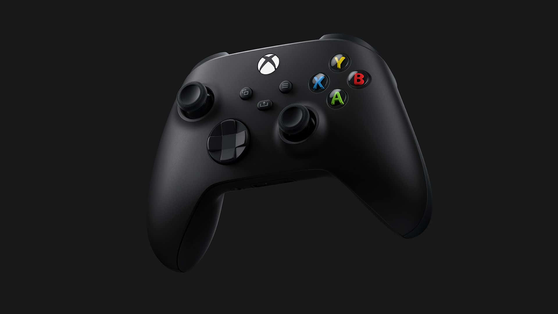體驗酷炫Xbox的樂趣！ 壁紙 — 一個時尚的啞光黑色Xbox手把漂浮在深色背景上，帶有發光的彩色按鈕。