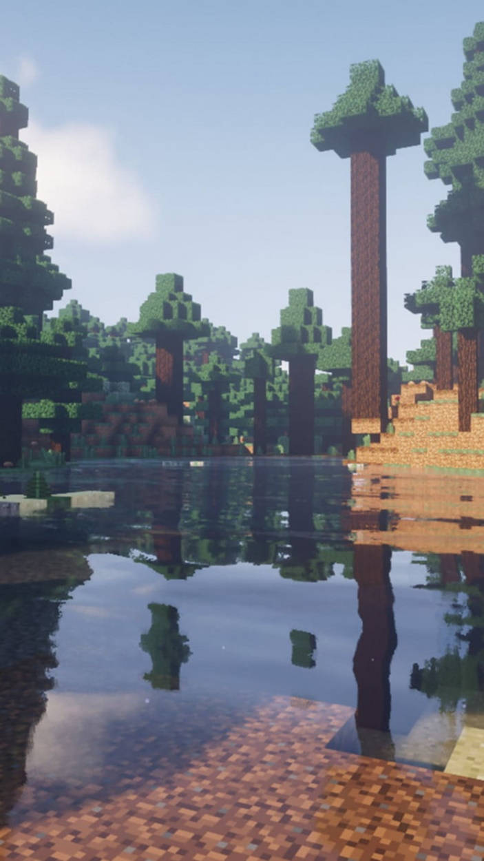 方塊Minecraft樹木喺晴朗天空下平靜嘅水面倒影。