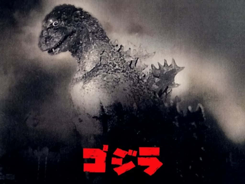 Godzilla 1954 桌布 壁紙 — 高聳的哥斯拉從煙霧中出現，眼睛發光，下方有紅色日文字。