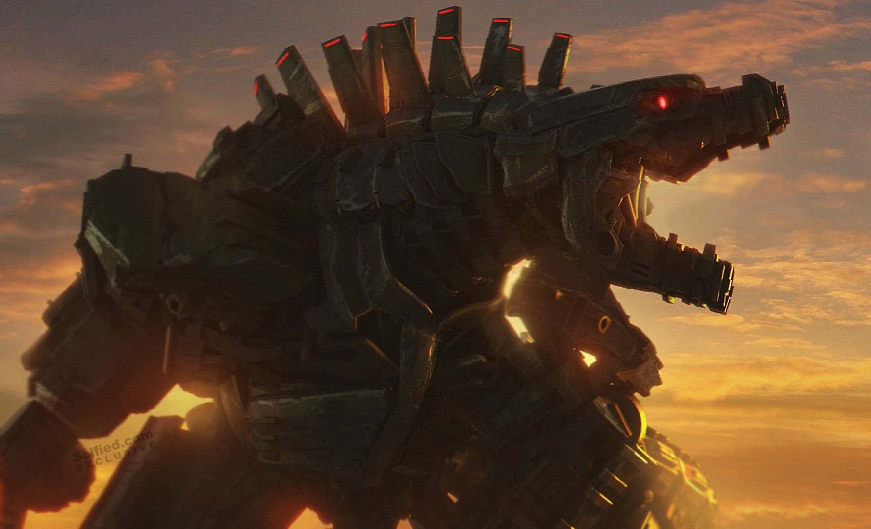 Robot Godzilla 桌布 壁紙 — 高聳的機械哥斯拉剪影，在火紅的夕陽天空下，閃爍著紅色的眼睛和背鰭。
