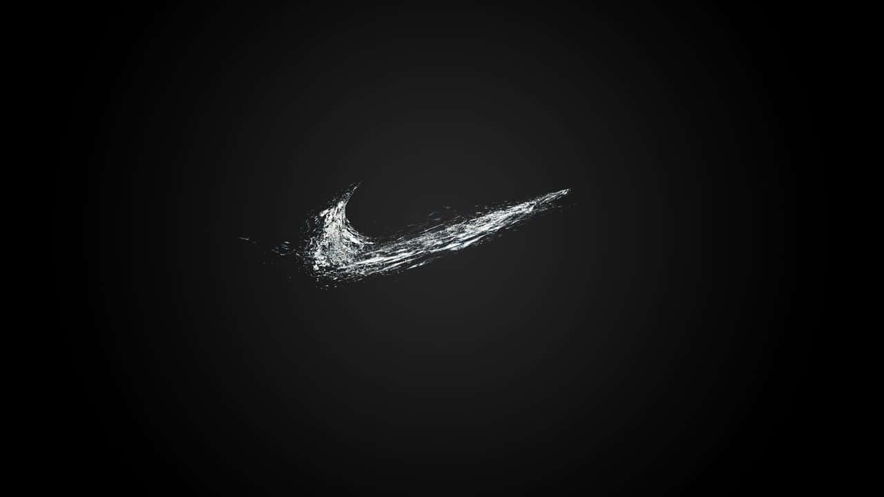 在深色漸變背景上由顆粒形成的白色Nike剔勾標誌。