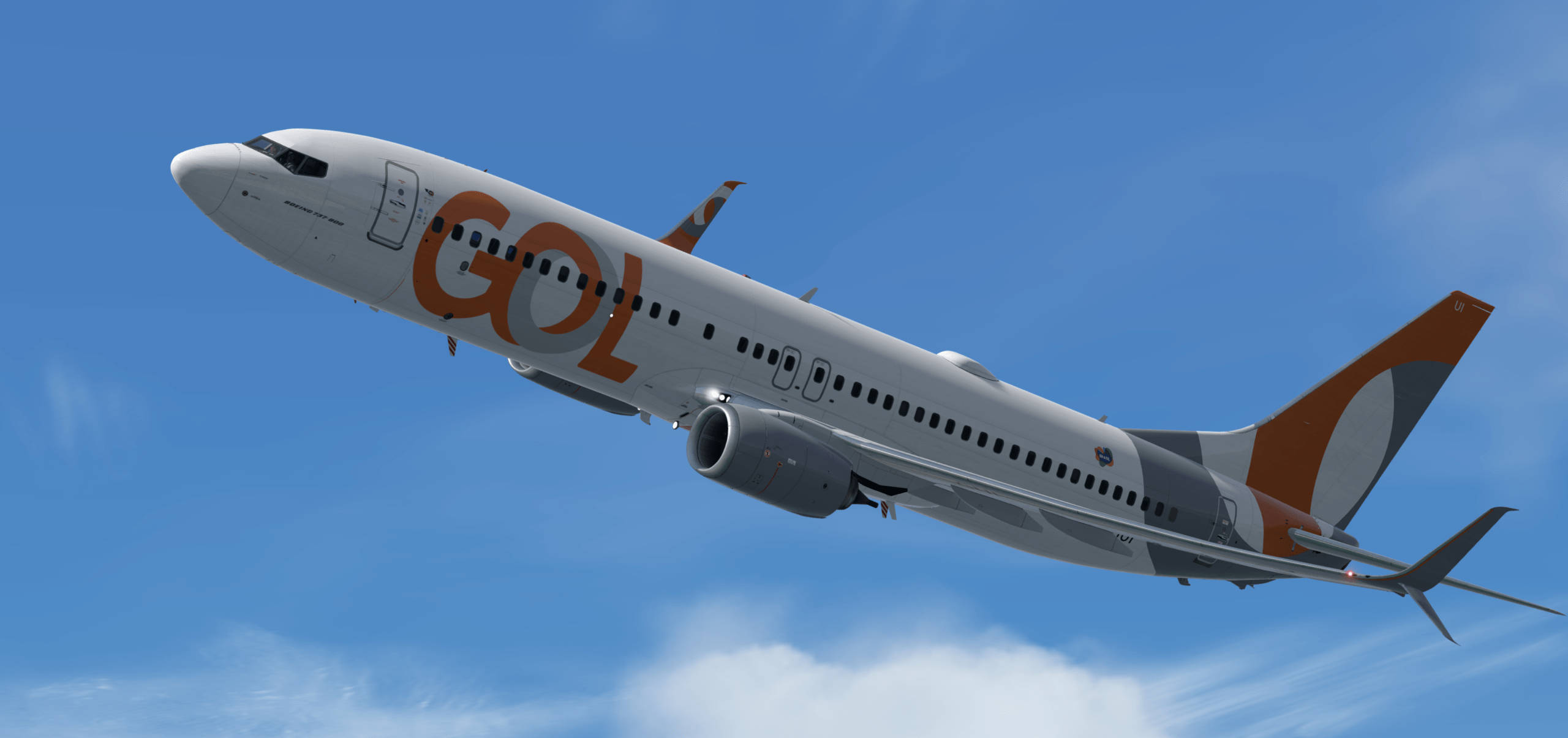 高飛的 Gol 航空公司飛機 壁紙 — GOL航空的客機在晴朗的藍天中翱翔，機翼下有縷縷白雲。