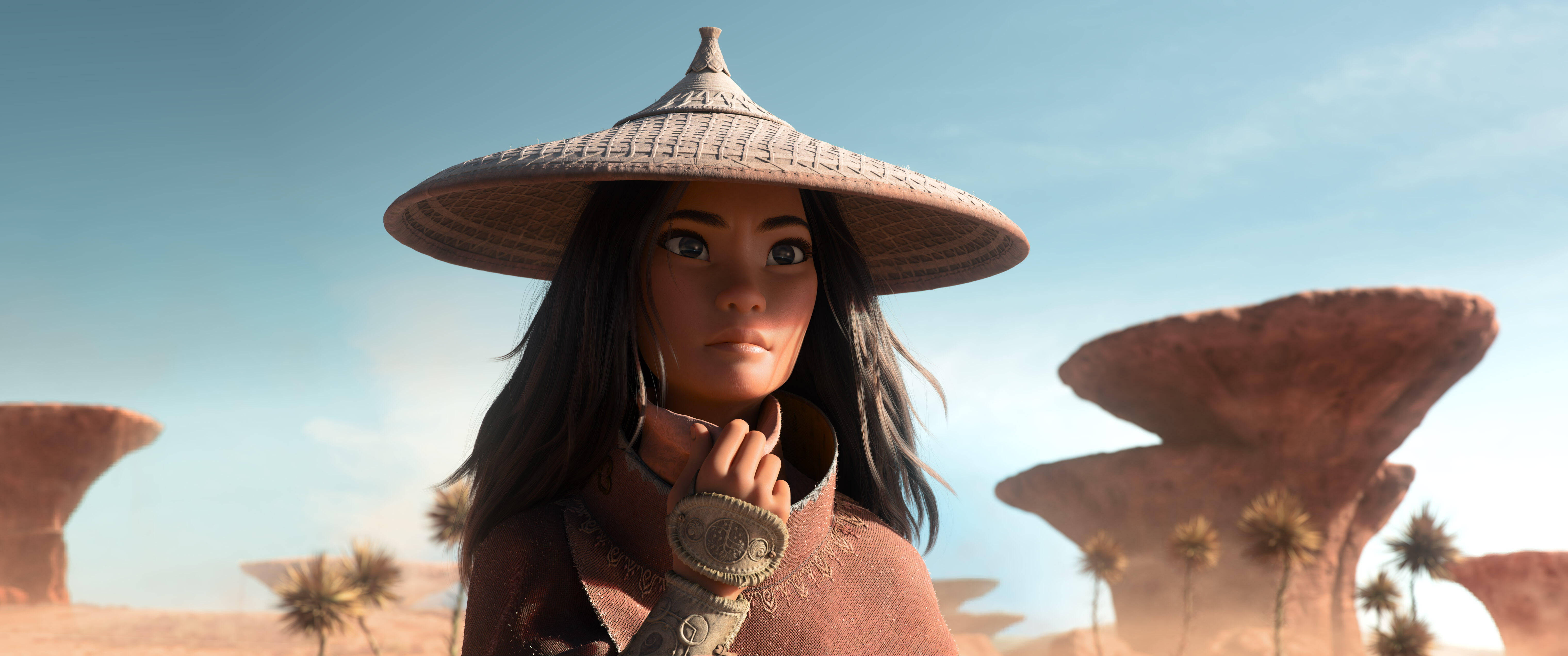 《魔海奇緣》雷亞沙漠尾部 壁紙 — 一位堅定的年輕女子戴著編織的圓錐形帽子，站在陽光明媚的沙漠中，周圍有蘑菇狀的岩石 formations 和棕櫚樹。