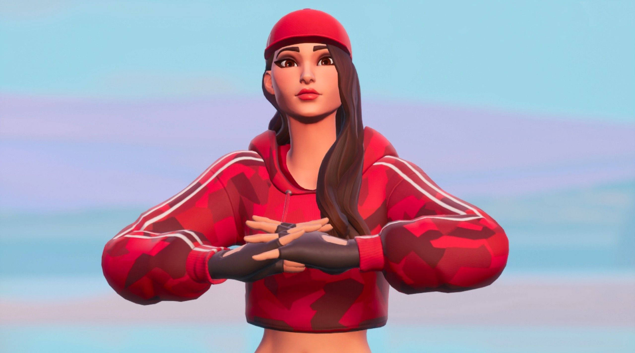 魯比《Fortnite》柔和漸層背景 壁紙 — 一個女性Fortnite角色穿著紅色迷彩連帽衫和帽子，雙臂交叉，自信地站在柔和的粉彩天空前。