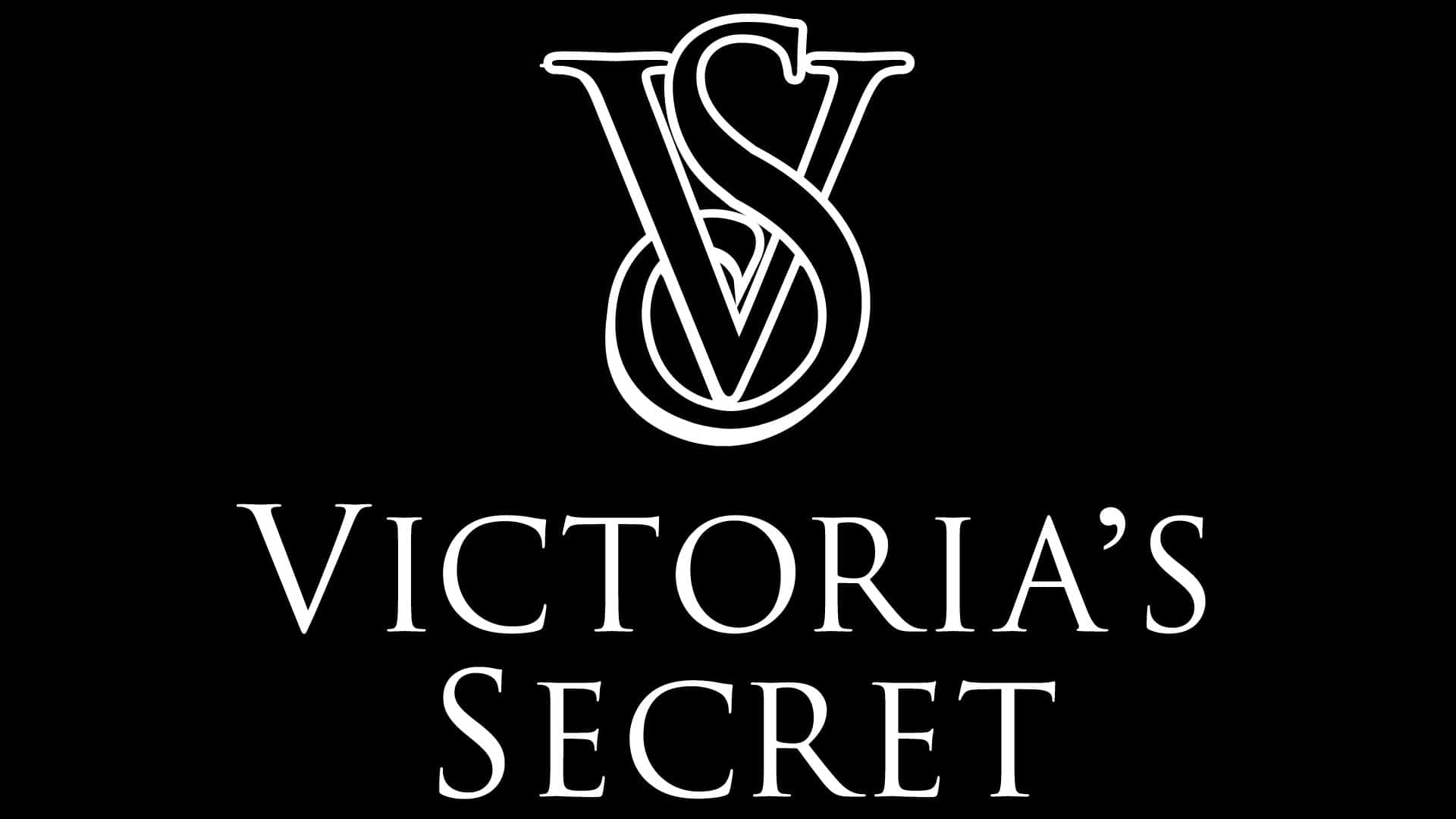 Victoria's Secret 桌布 壁紙 — 鮮明的黑色背景上，展示了標誌性的白色Victoria's Secret標誌，交織的V和S字母組合位於優雅襯線字體的品牌名稱上方。