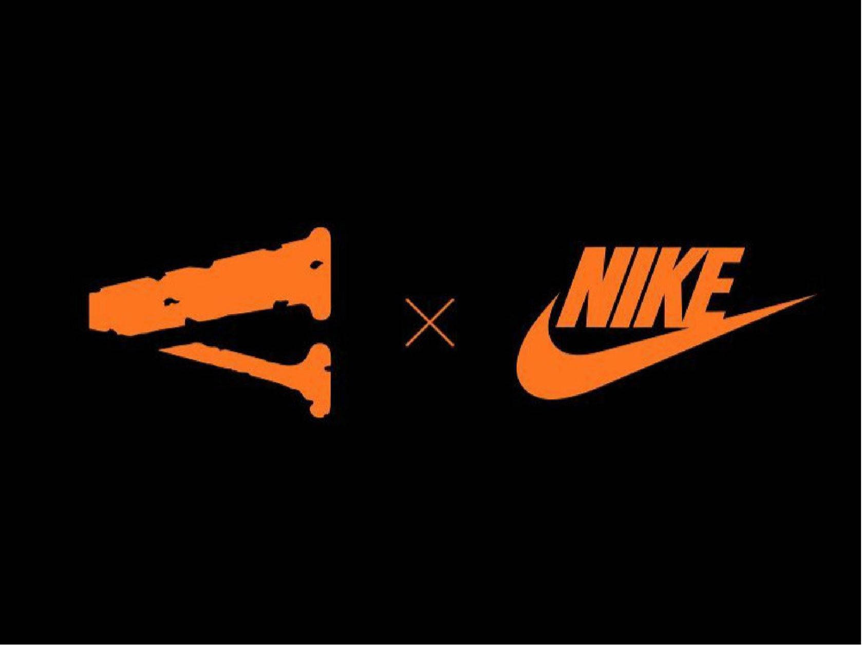 VLONE X Nike 壁紙 — 鮮橙色 Staple x Nike 聯乘標誌，襯托在純黑背景上。
