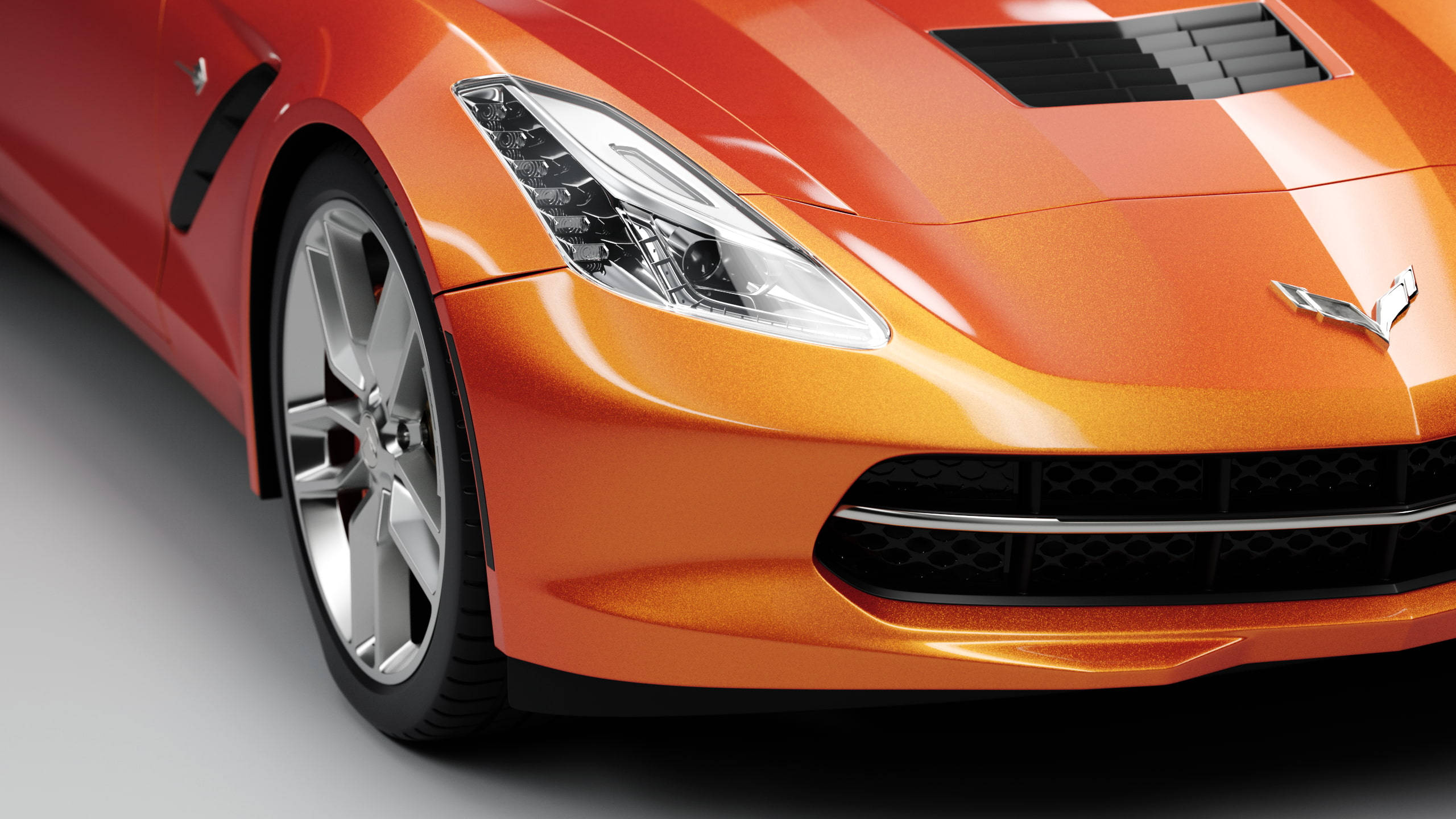 Sports Car 桌布 壁紙 — 鮮豔橙色跑車的特寫，展示其時尚車頭燈和空氣動力學前保險桿。
