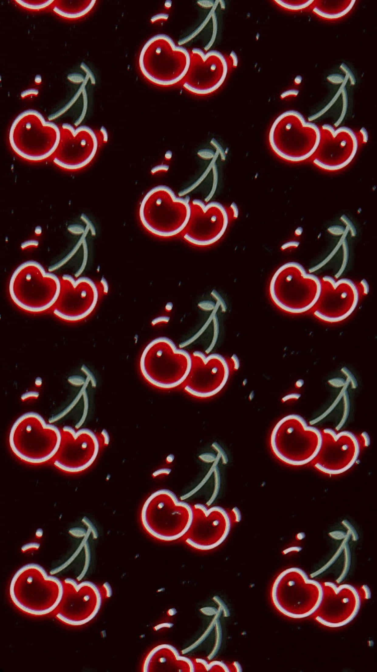 Cherry 桌布 壁紙 — 鮮豔發光的紅色櫻桃帶有白色輪廓，在深色斑點背景上以風格化圖案重複。