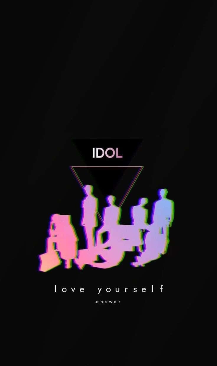 The Idol 桌布 壁紙 — 鮮豔的故障粉紅和藍色調的人物剪影站在一個發光的三角形下方，三角形上有IDOL字樣，背景為黑色。