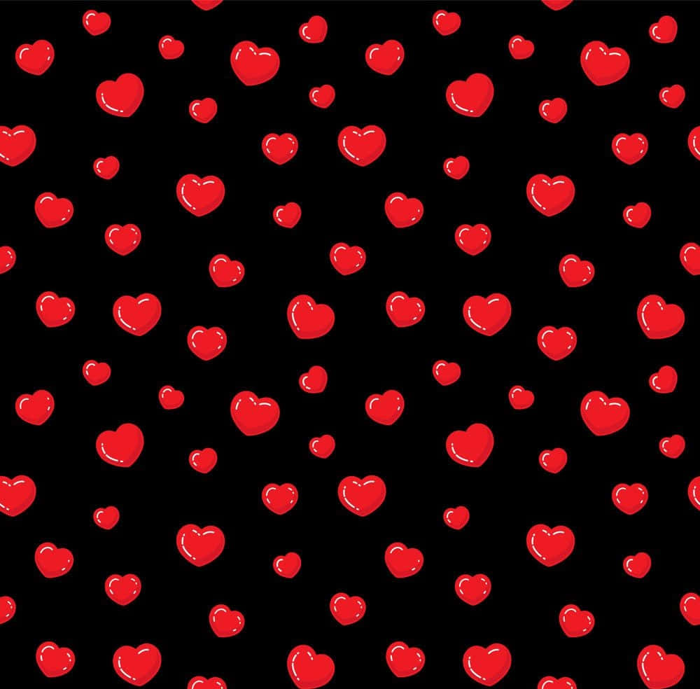 Heart Pattern 桌布 壁紙 — 鮮豔的紅色心形在鮮明的黑色背景上以俏皮的散落圖案漂浮。