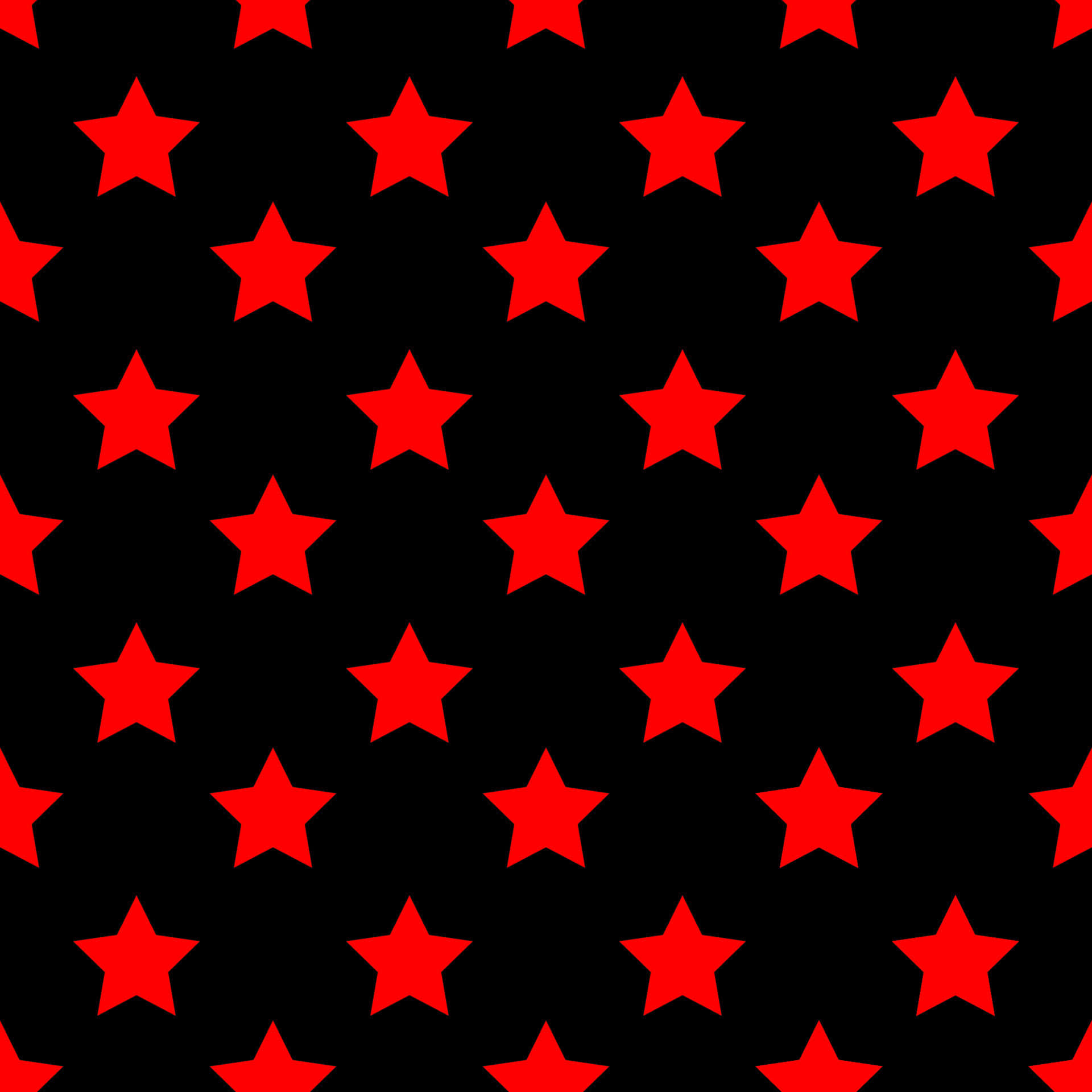 Red Star 桌布 壁紙 — 鮮豔的紅色星星在純黑色背景上以緊密網格重複，形成大膽的圖形圖案。