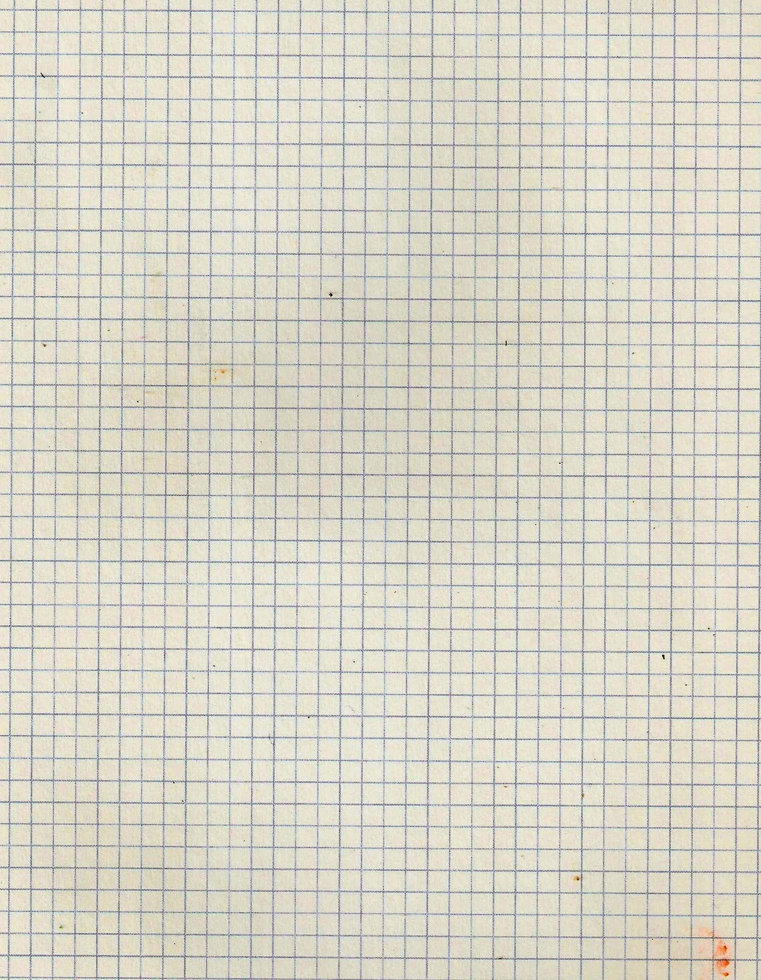 帶有藍色網格線的污漬方格紙特寫。