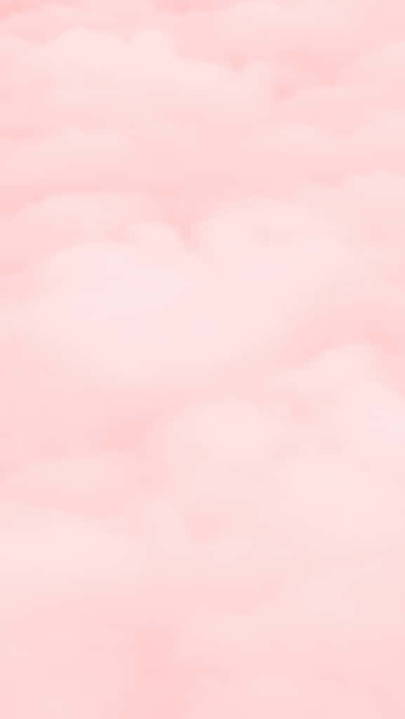 柔和光線同溫柔質感嘅寧靜天空中飄浮嘅粉紅色雲朵。