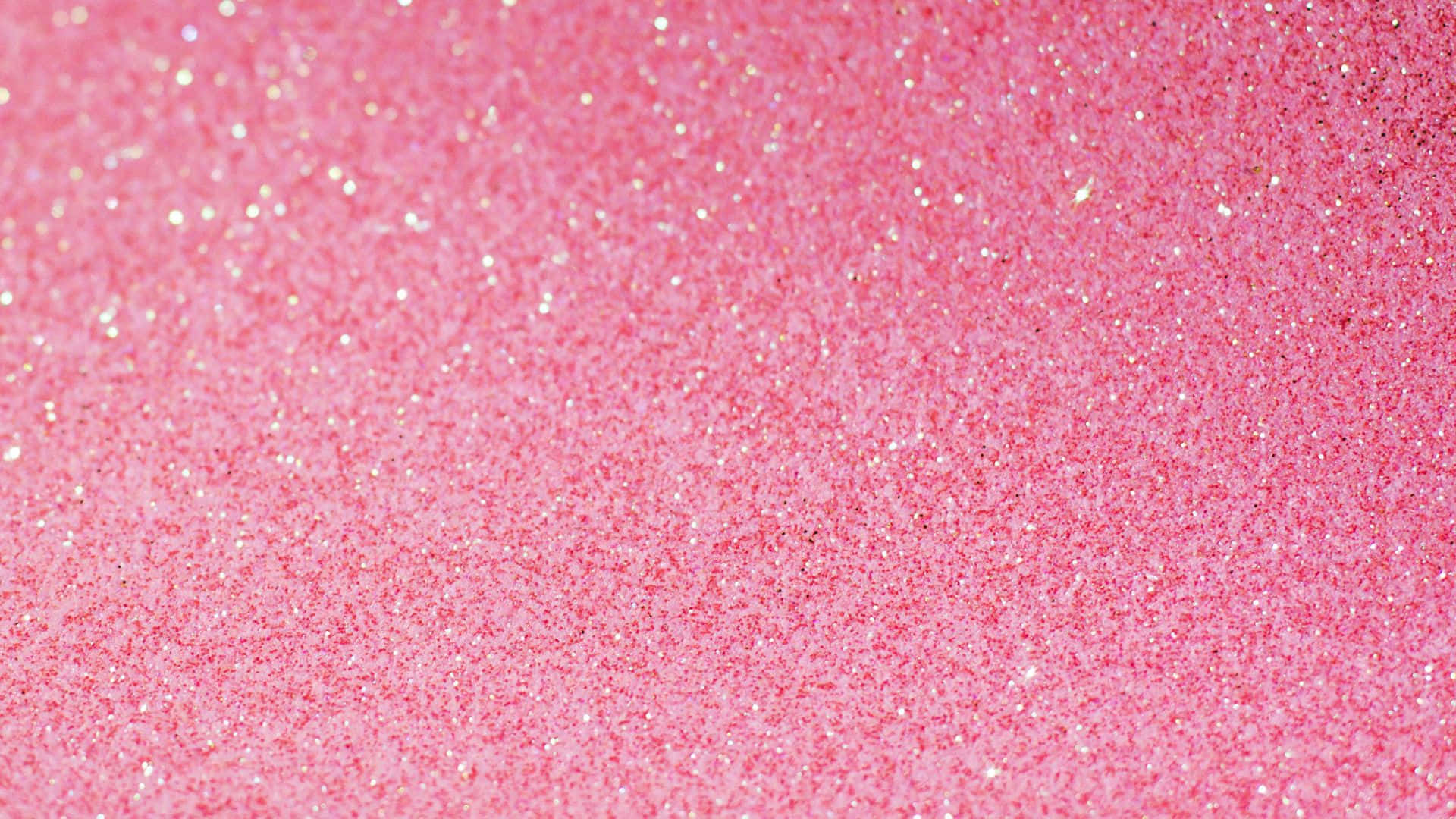 Pink Sparkles 桌布 壁紙 — 鮮豔粉紅閃粉的近距離特寫，帶有閃爍的銀色斑點捕捉光線。