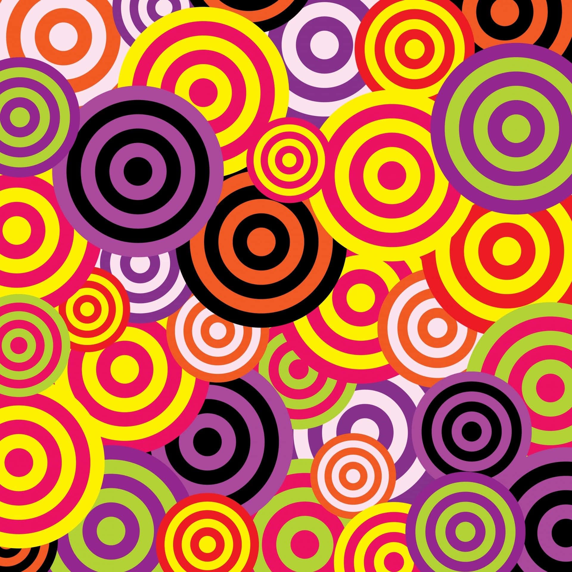 Psychedelic 70s Aesthetic 桌布 壁紙 — 鮮豔重疊的同心圓以大膽色彩營造出高對比度和復古能量的迷幻圖案。