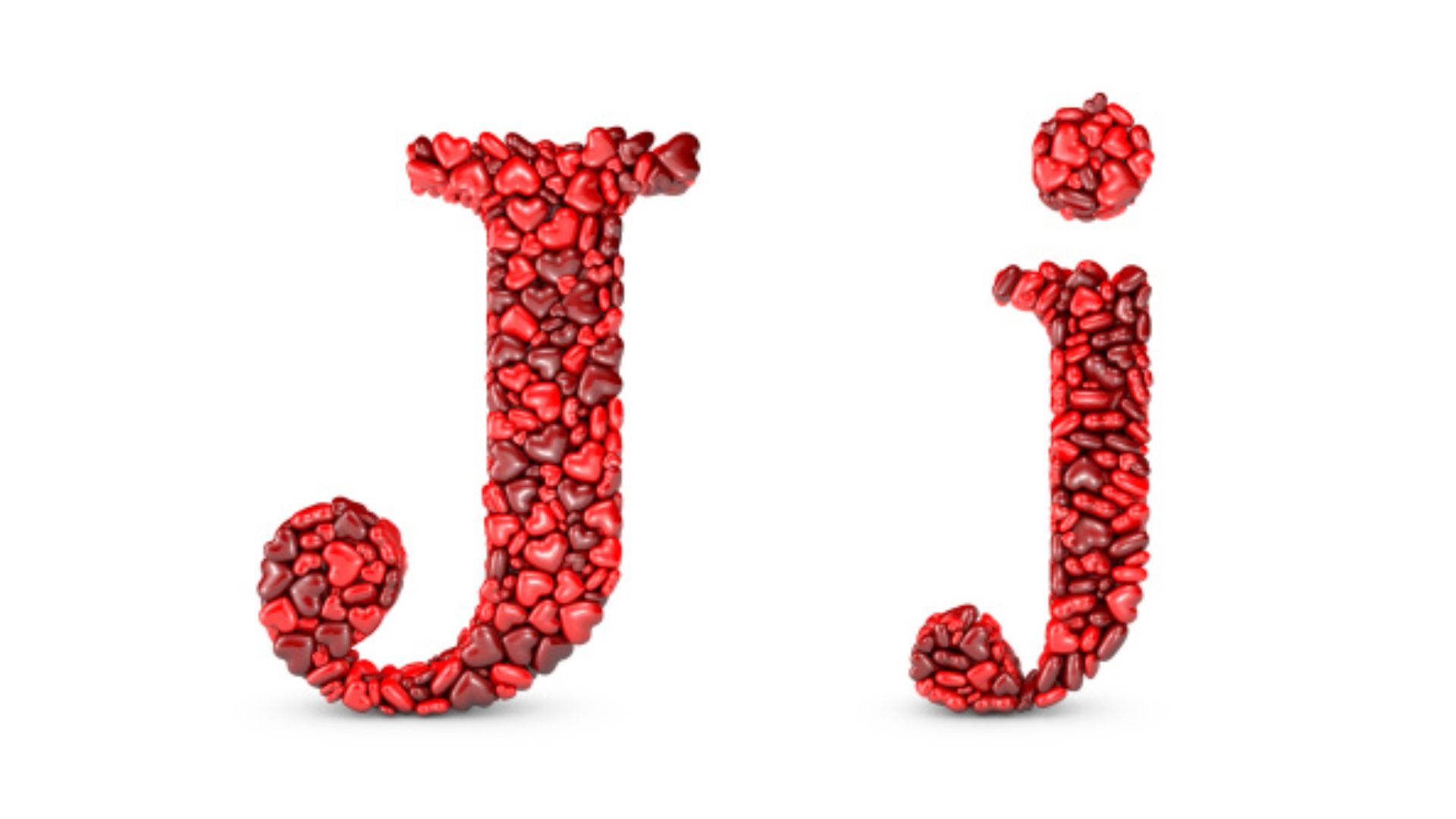 紅色心形石頭排列成大寫和小寫字母 J。