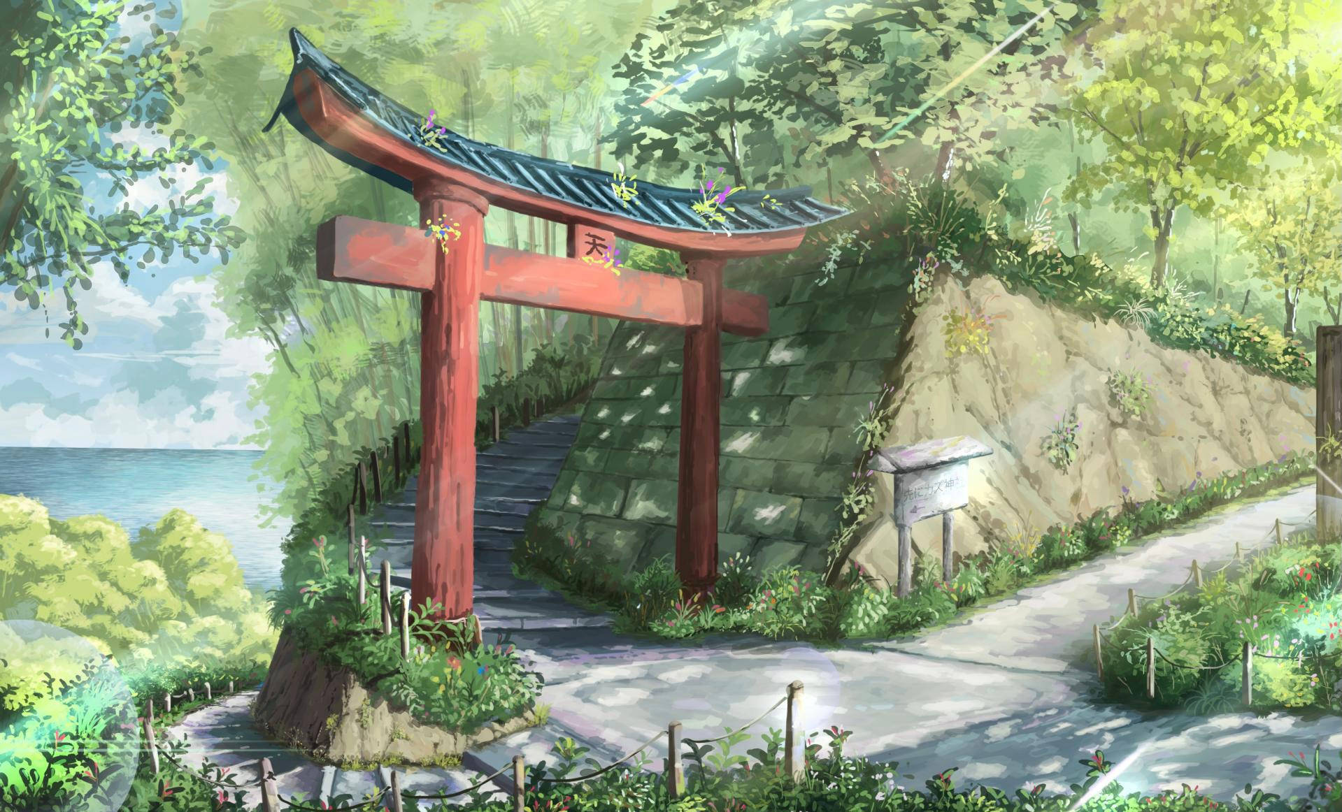 鳥居風景 壁紙 — 一座鮮紅色的鳥居矗立在海岸小徑入口，周圍環繞著茂密的綠植和晴朗天空下的海景。